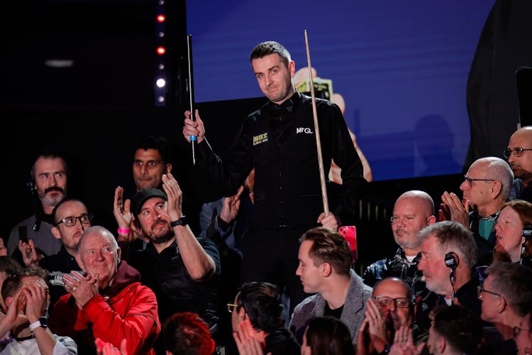 Snooker player amongst a crowd