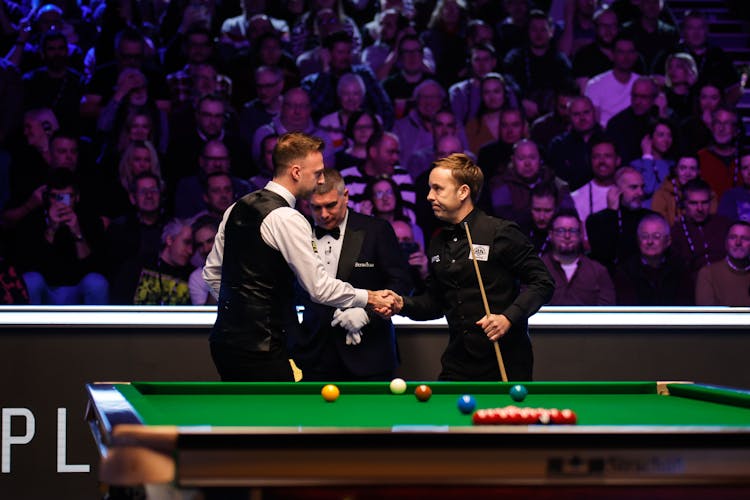 Two snooker players shaking hands post match