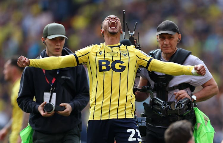 Josh Murphy of Oxford United celebrates promotion to the Sky Bet Championship after the team's victory in the Sky Bet League One Play