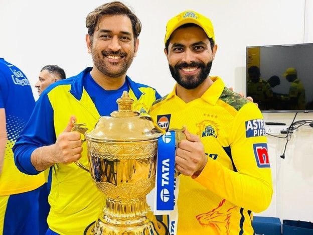 MS Dhoni holding an IPL trophy
