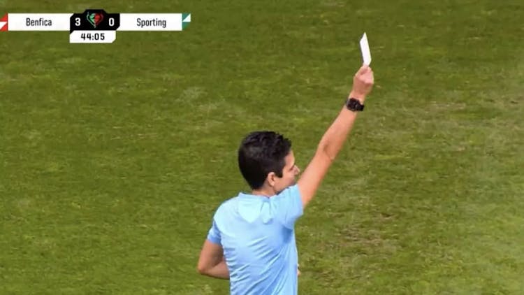 Referee Catarina Campos showing the first ever white card in football
