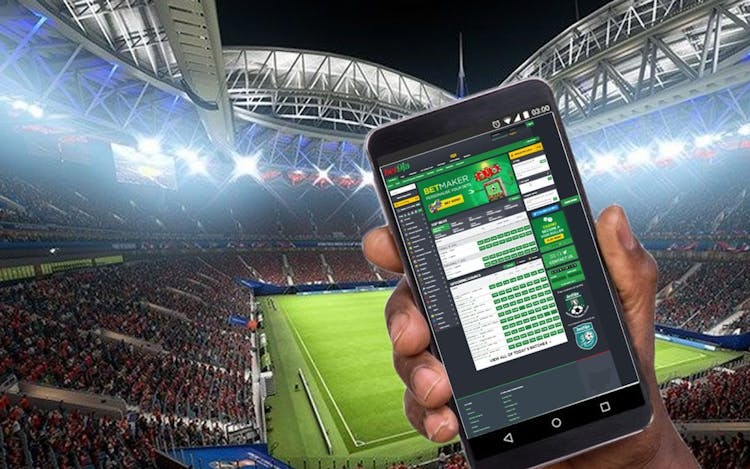  Bet9ja betting application opened in a phone in a football stadium 