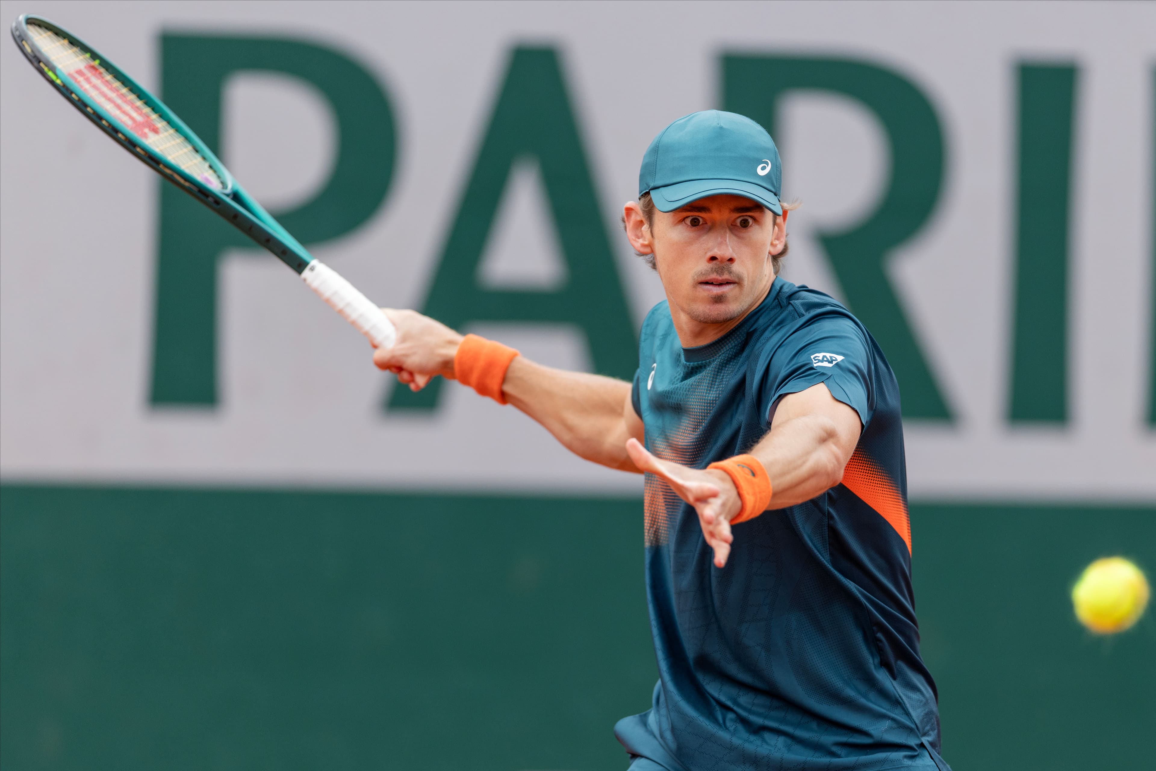 Alex De Minaur in action against Laslo Deere.jpg