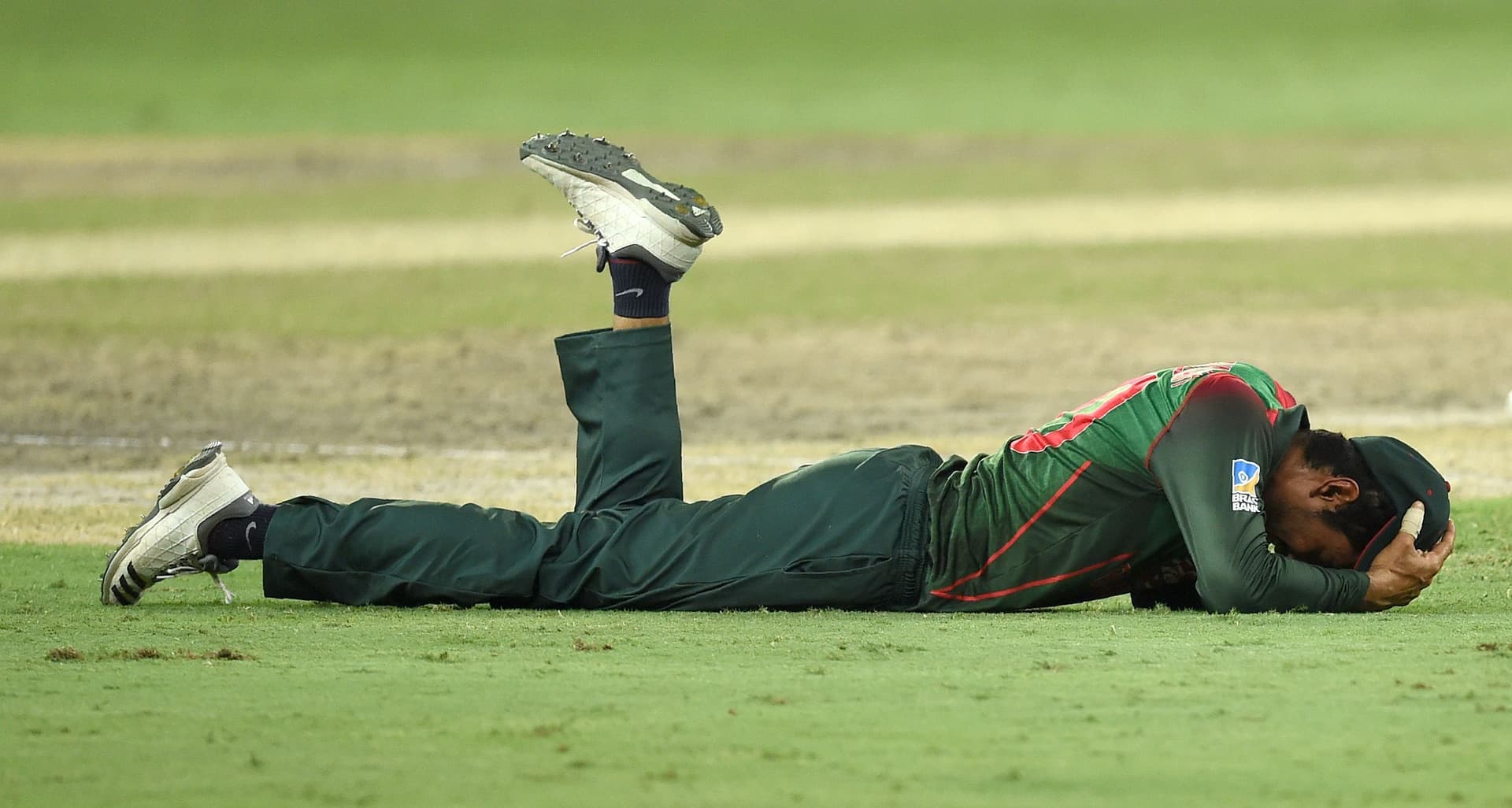 Bangladesh cricketer Mahmudullah lies on the ground.jpg