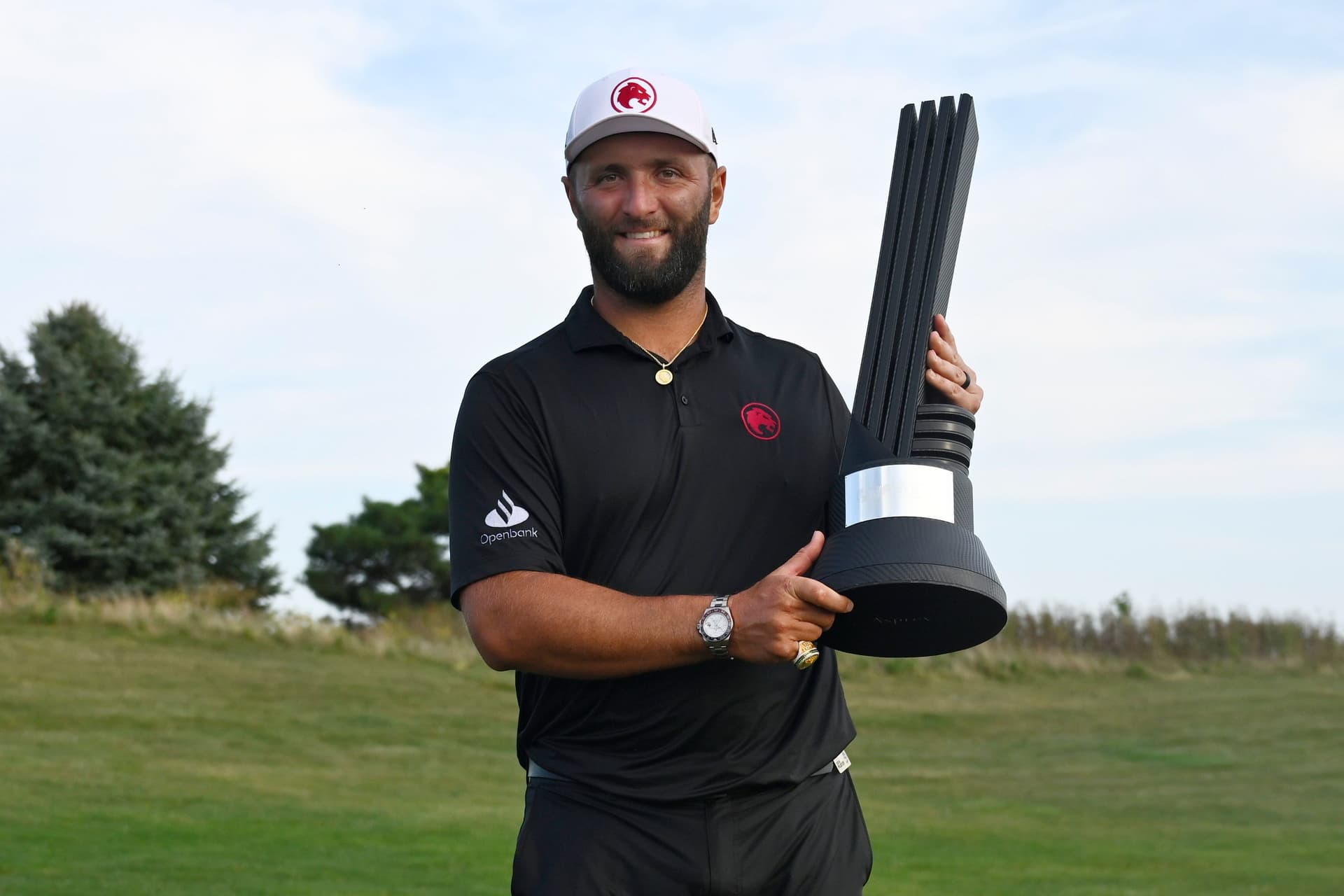 Jon Rahm, Spain, of the Legion XIII poses with the trophy