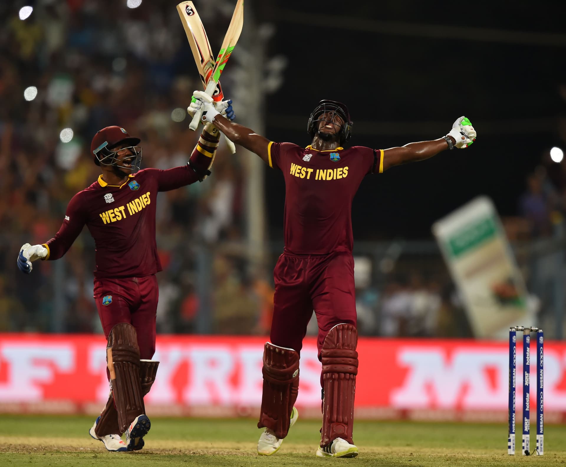 Carlos Brathwaite and teammate Marlon Samuels