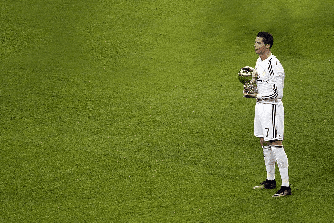 Cristiano Ronaldo holds his third Ballon d'Or at the Santiago Bernabéu in January 2015 // Image: Anish Morarji // CC BY 2.0 //