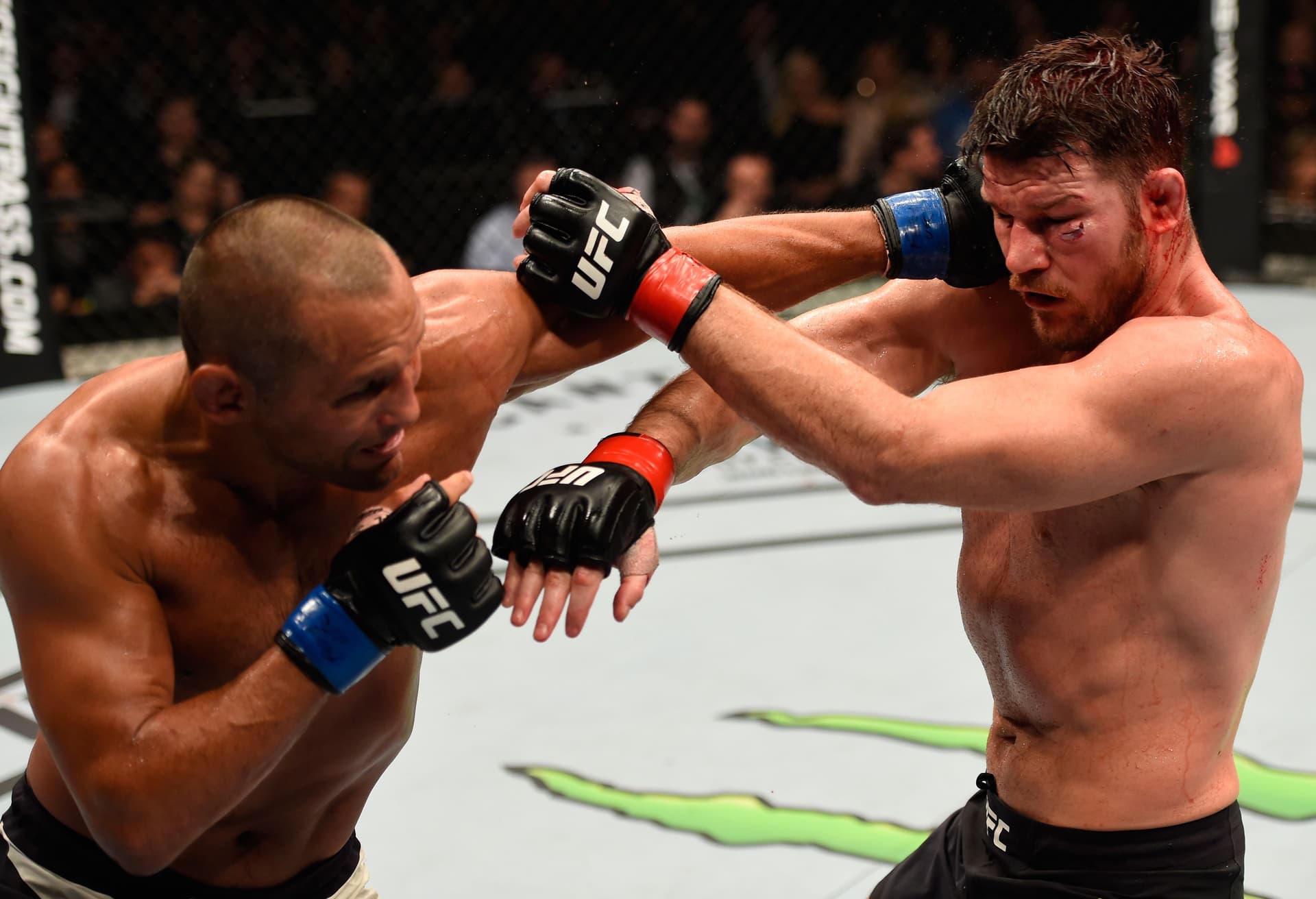 Dan Henderson punches Michael Bisping of England 
