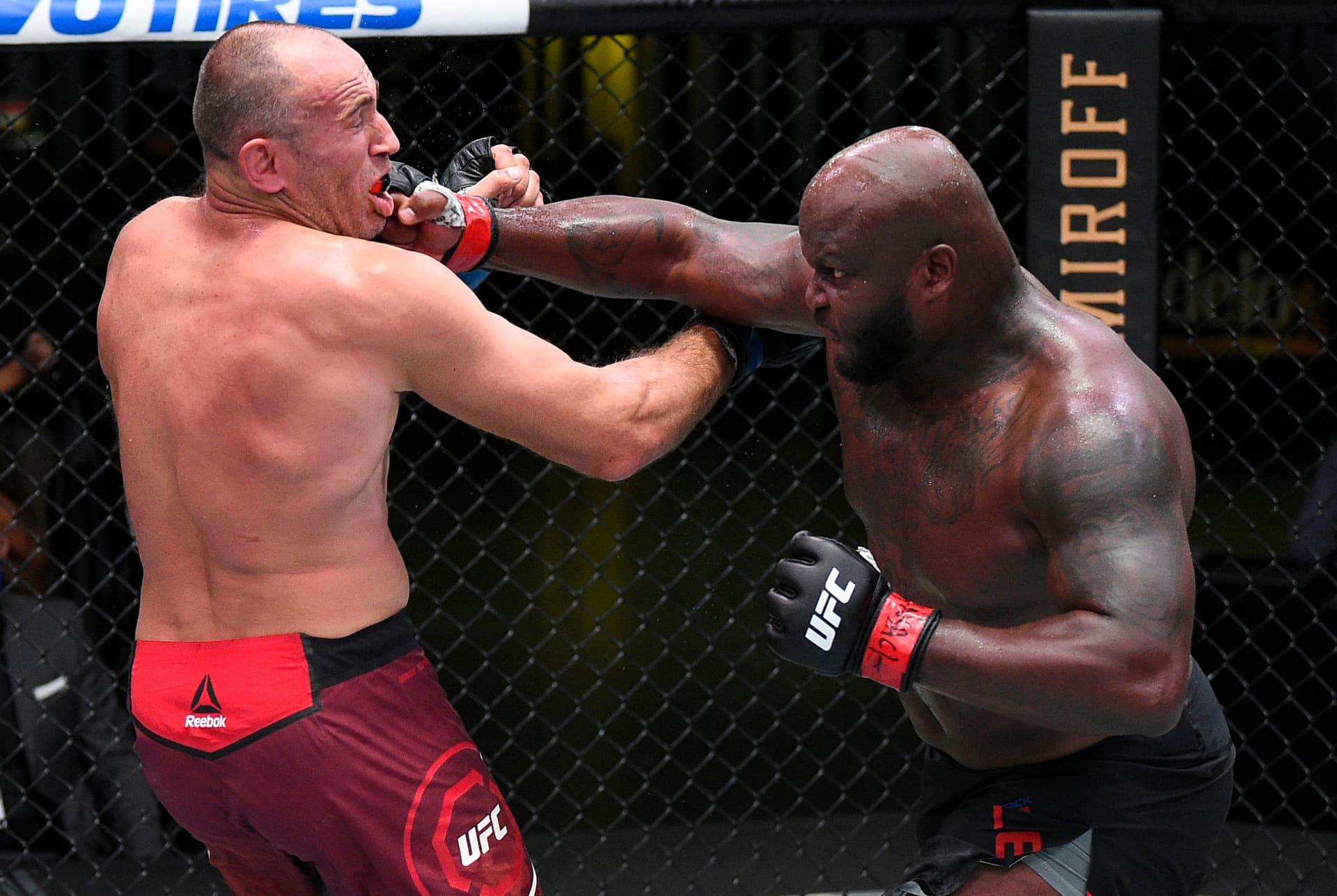 Derrick Lewis punches Aleksei Oleinik of Russia 