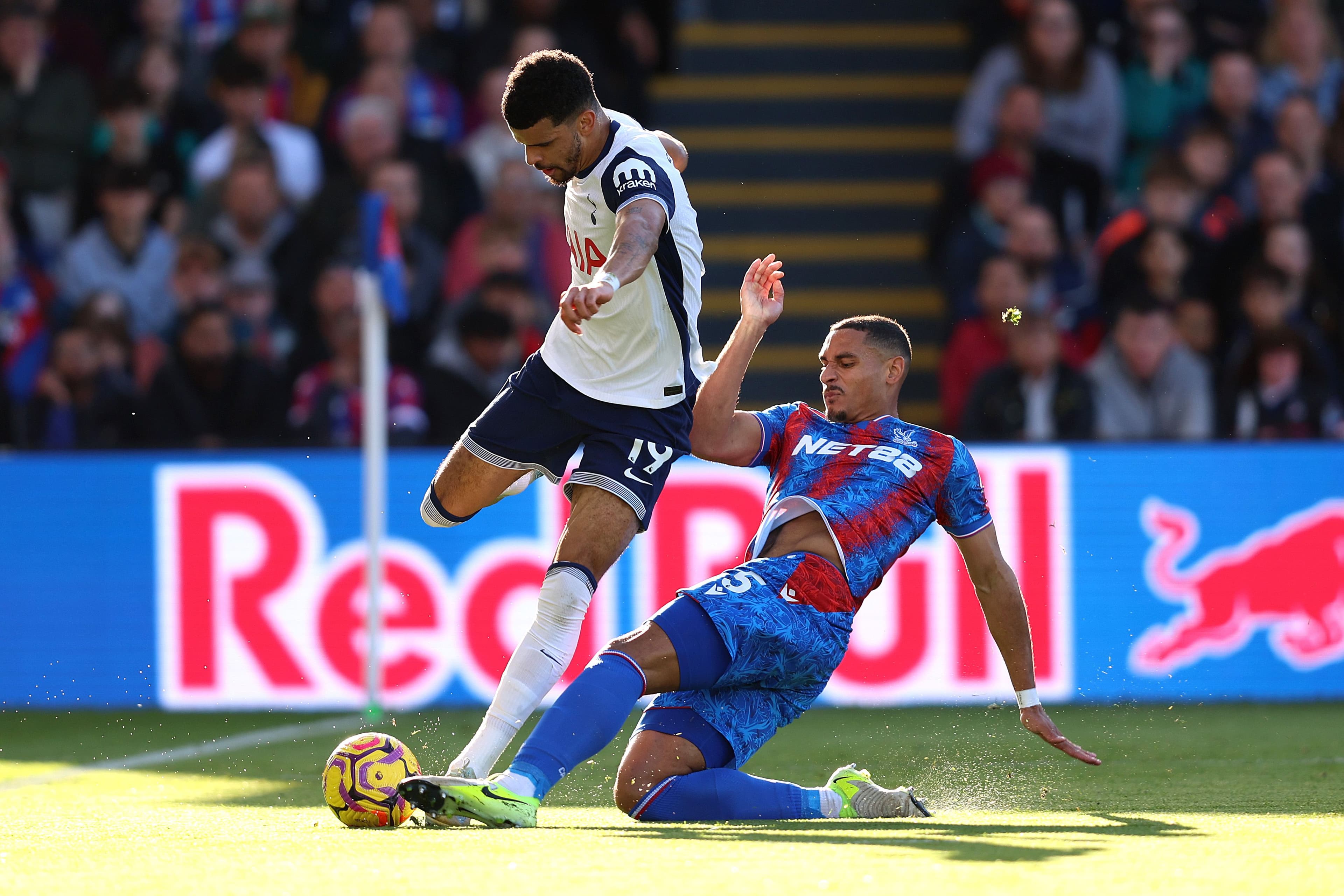 Dominic Solanke is challenged by Maxence Lacroix