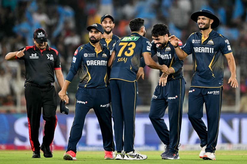 Gujarat Titans' Rashid Khan celebrates with teammates