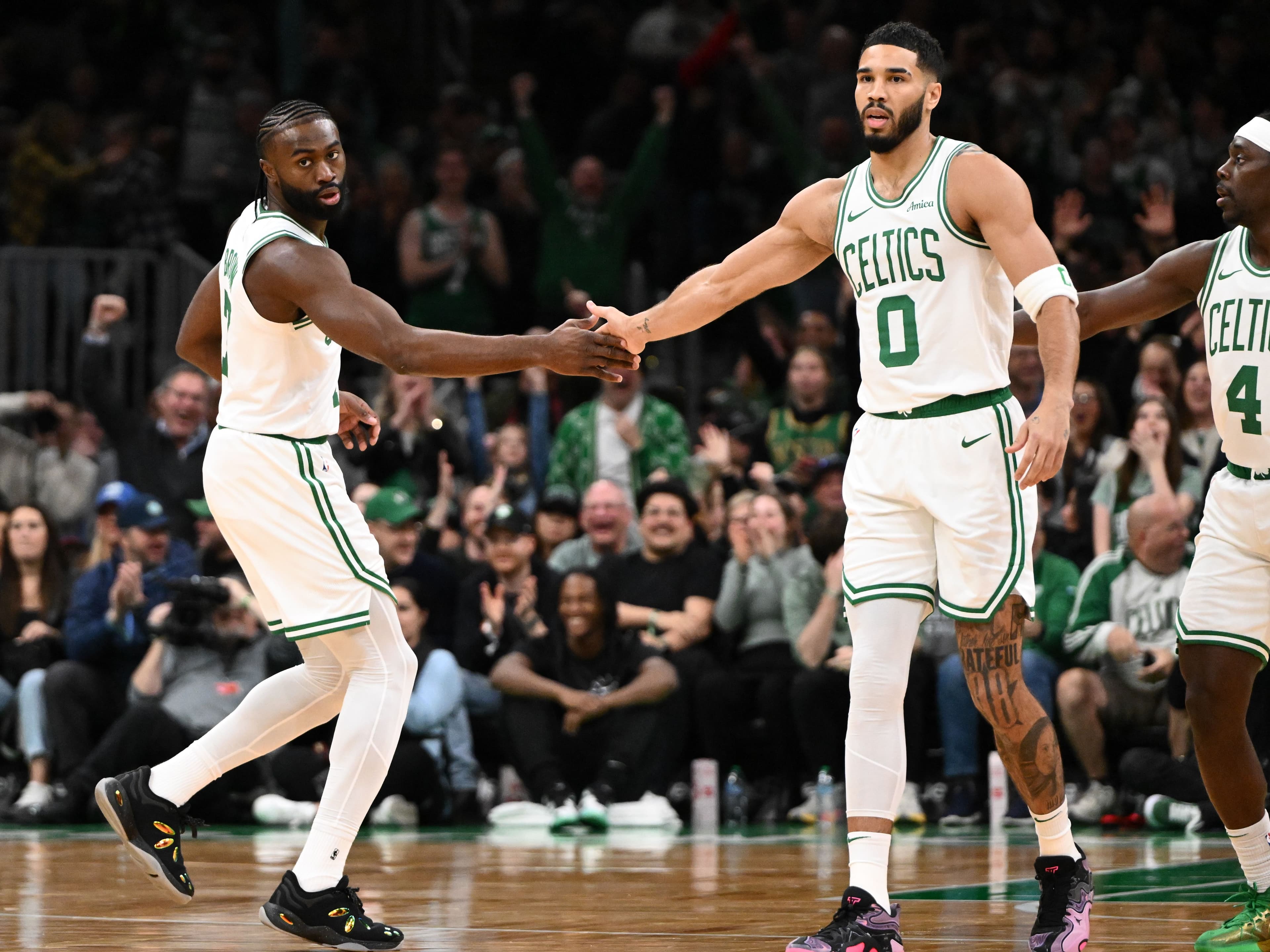 Jaylen Brown high-fives Jayson Tatum