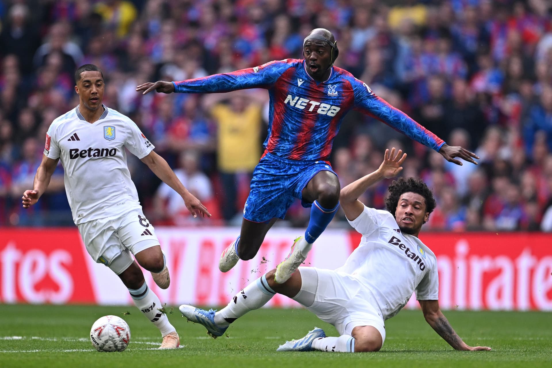 Jean-Philippe Mateta is challenged by Youri Tielemans