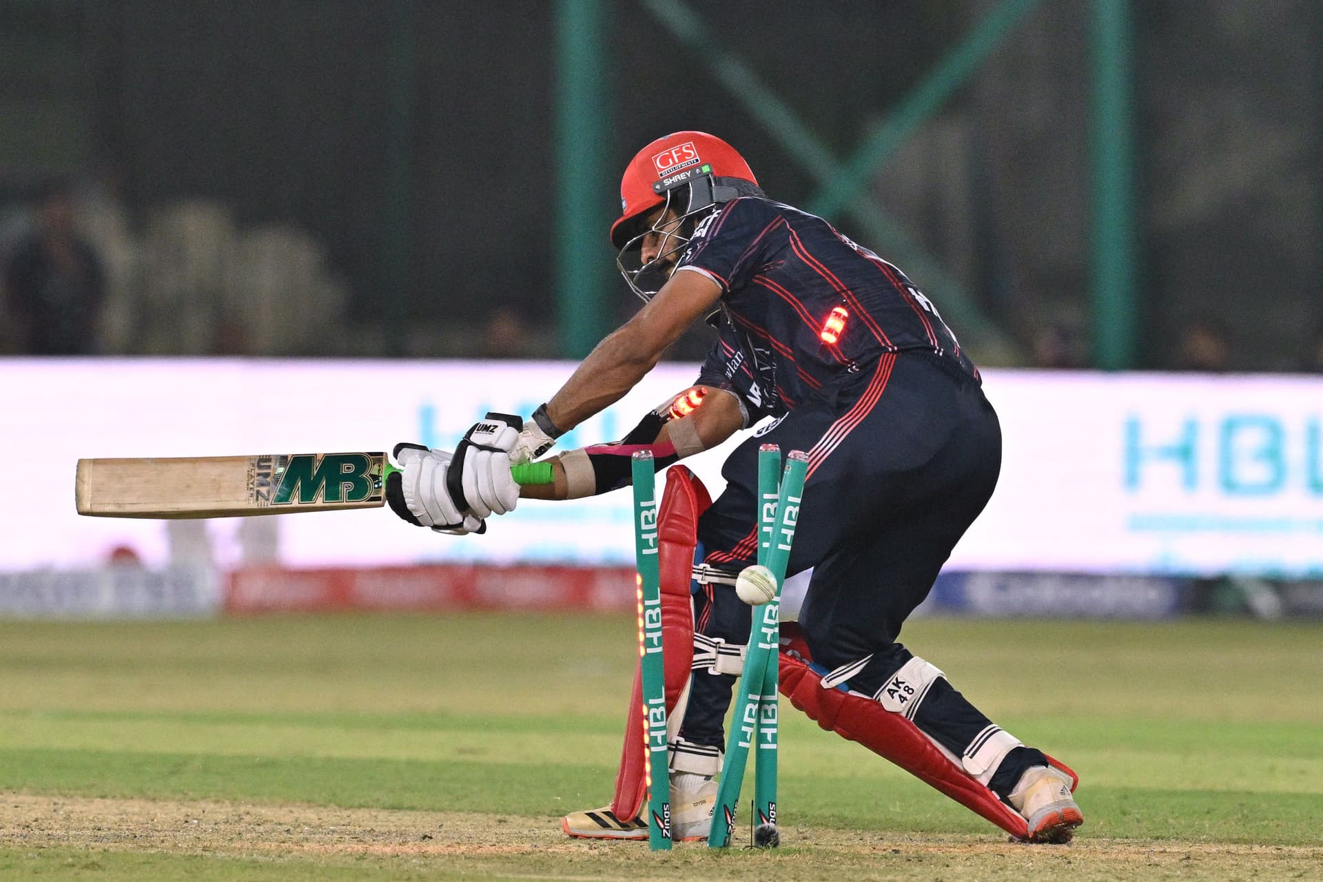 Karachi Kings' Pakistani bowler Hasan Ali is clean bowled by Lahore Qalandars' Pakistani bowler Shaheen Shah Afridi