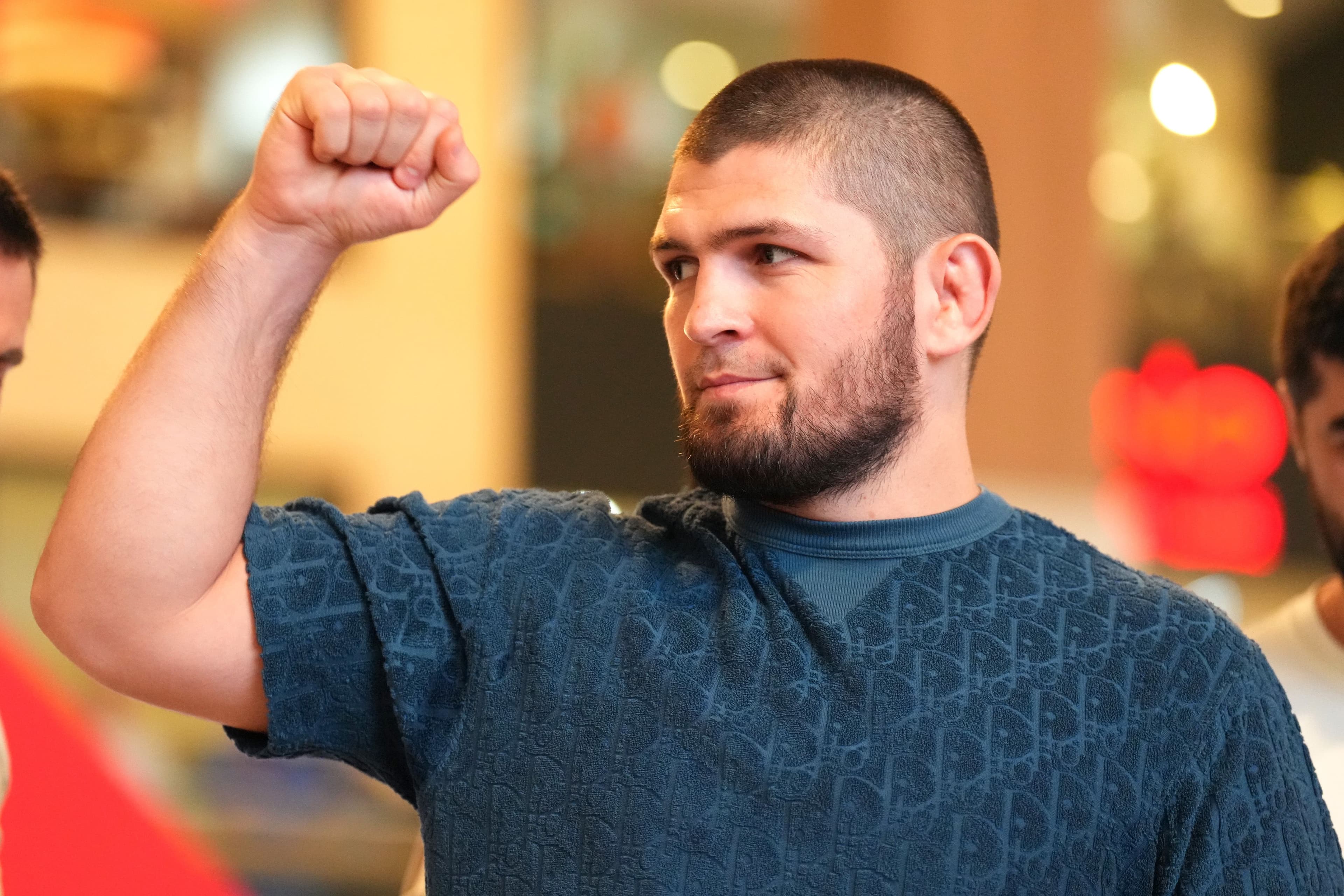 Khabib Nurmagomedov gestures to fans