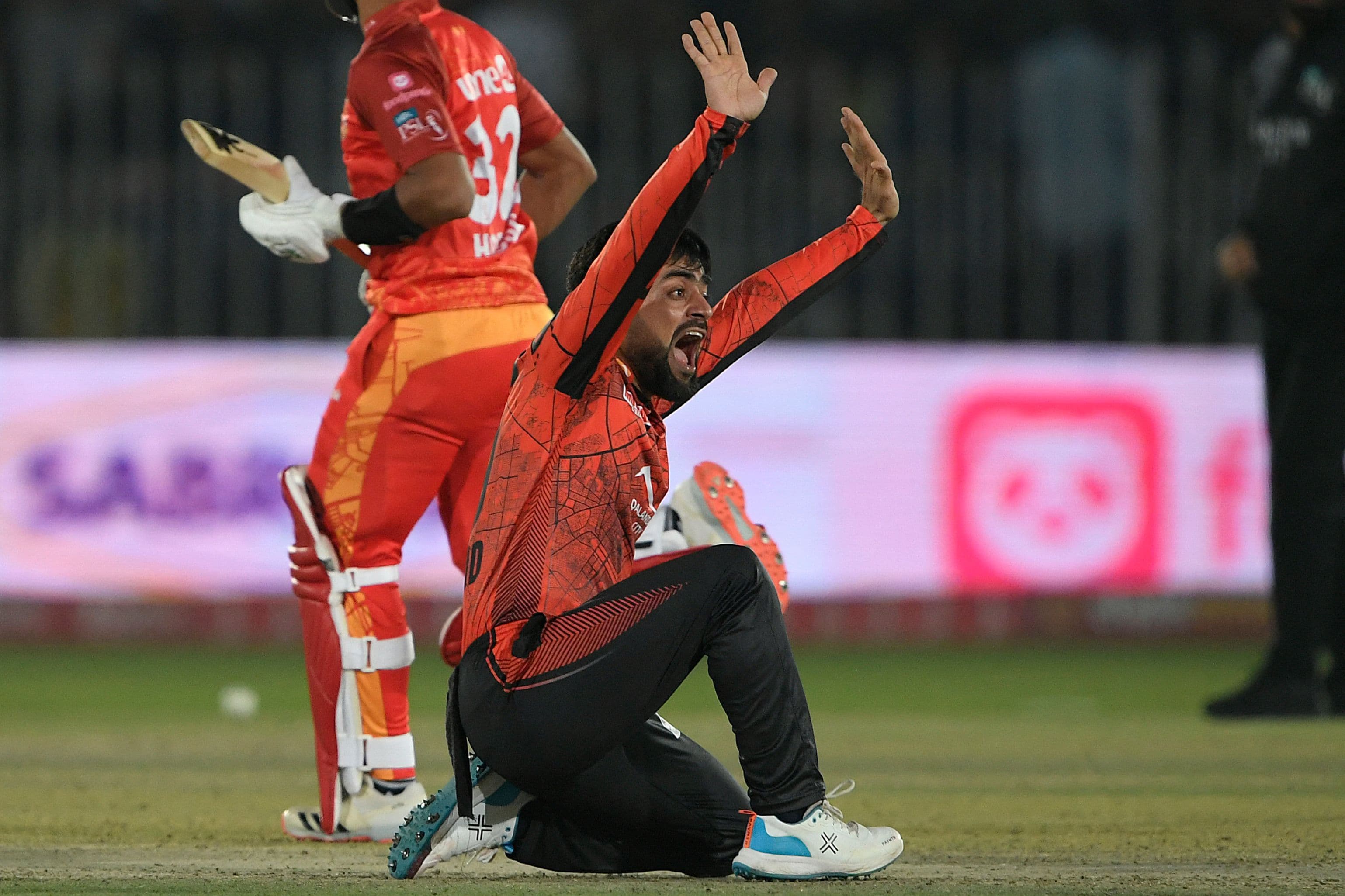 Lahore Qalandars' Rashid Khan shouts for an appeal 