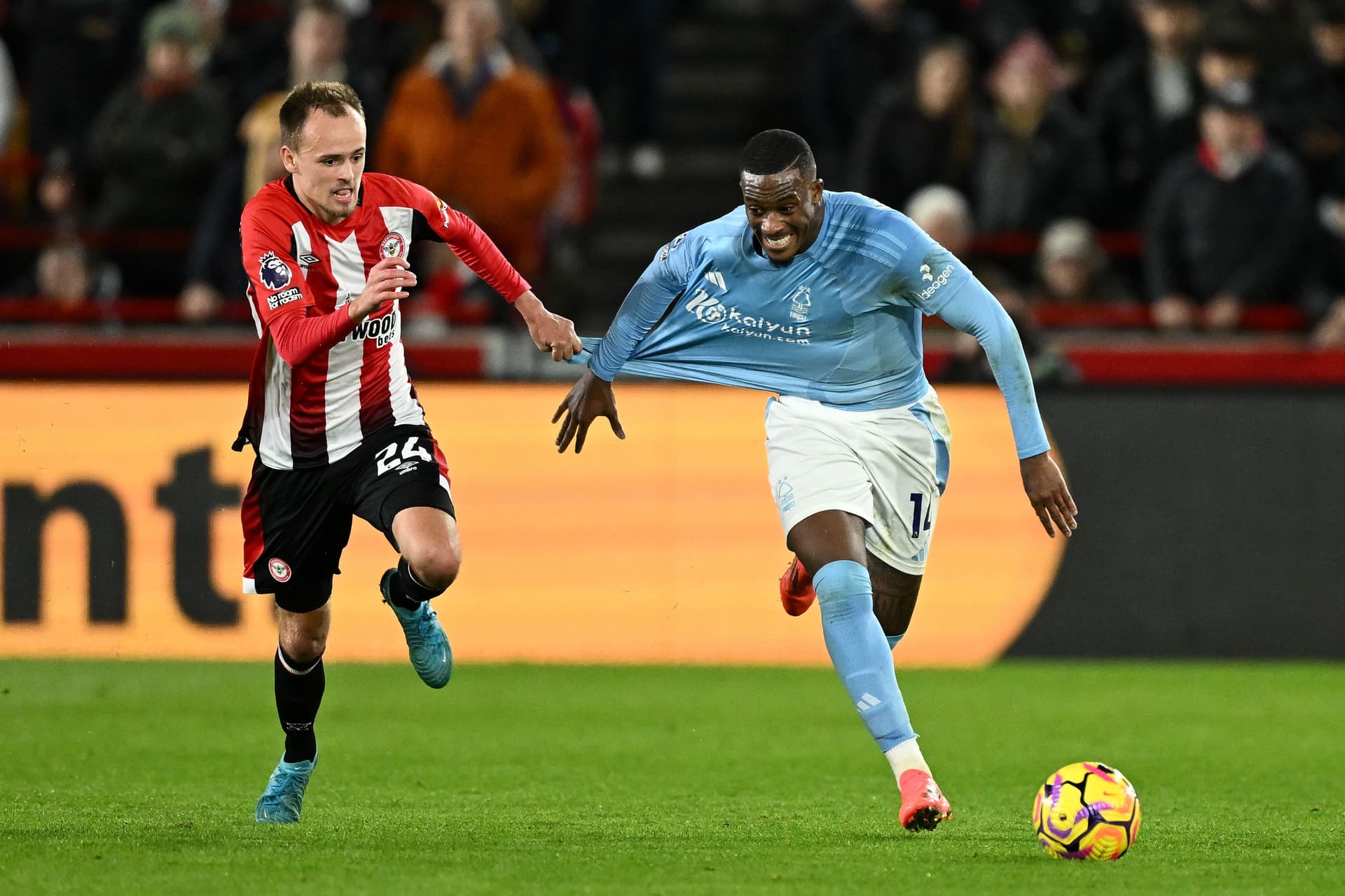 Mikkel Damsgaard pulls the shirt of Callum Hudson-Odoi