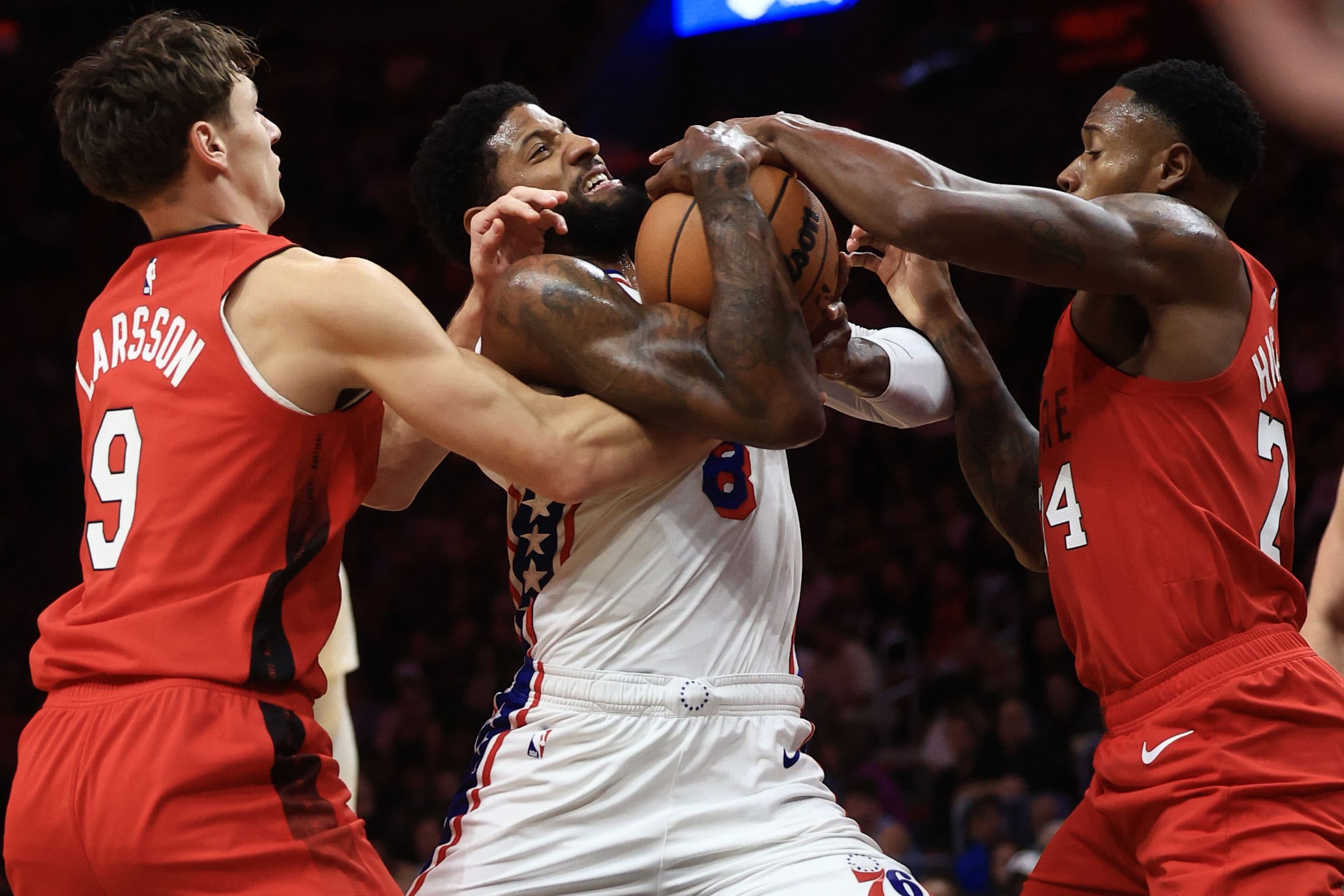Pelle Larsson battles Paul George for ball control 