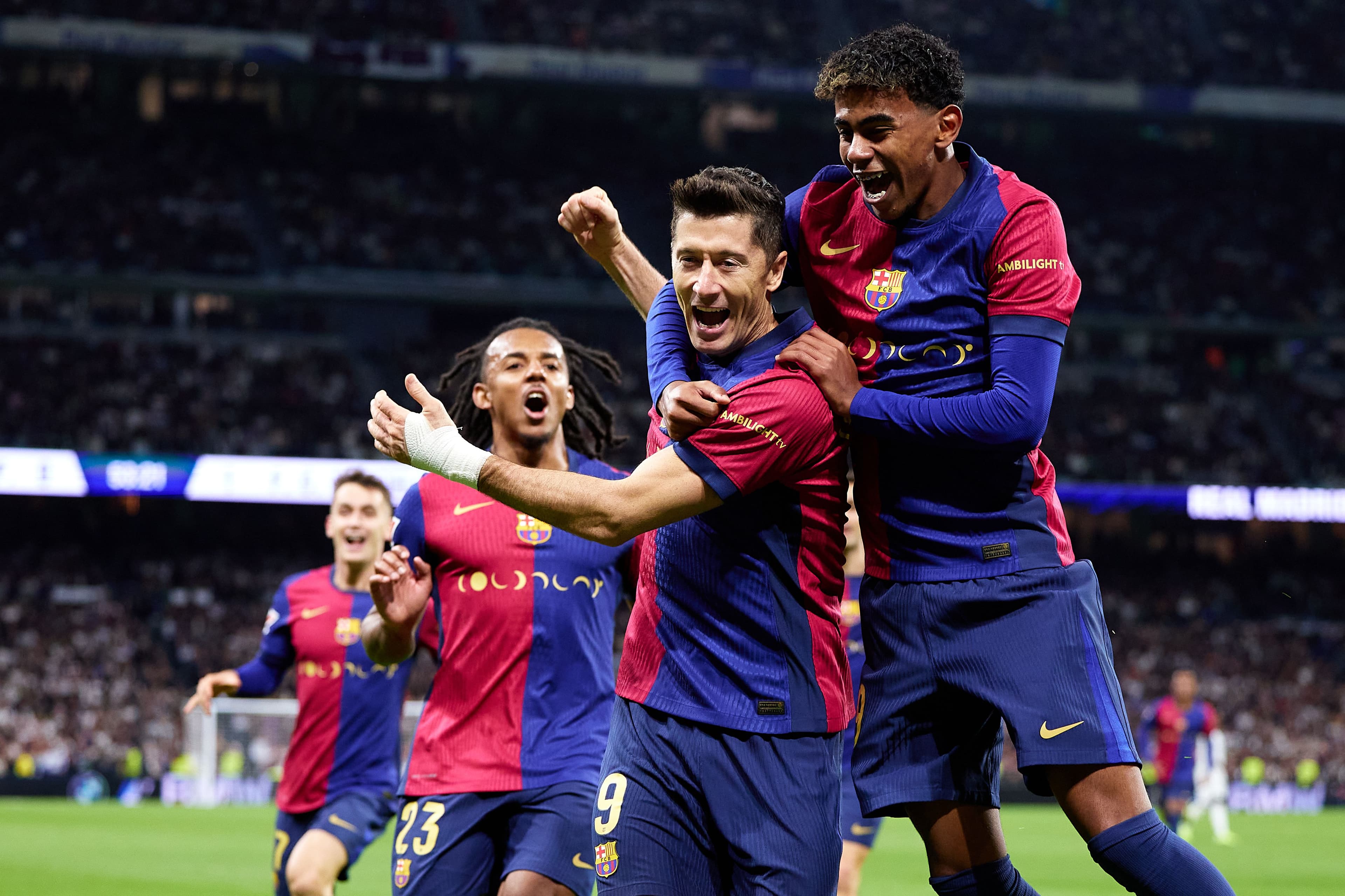 Robert Lewandowski celebrating with Lamine Yamal