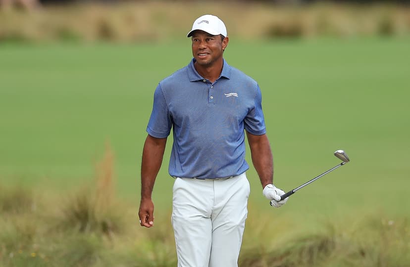 Tiger Woods of The United States plays a shot