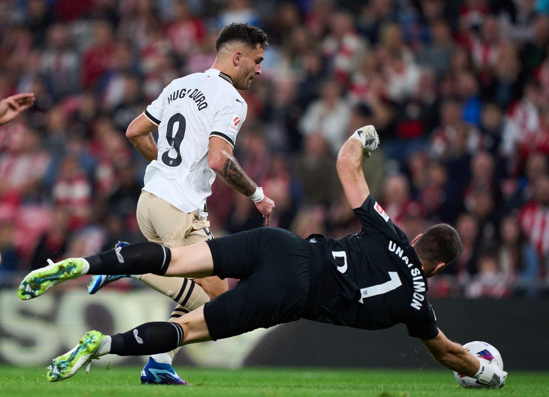 Unai Simon duels with Hugo Duro