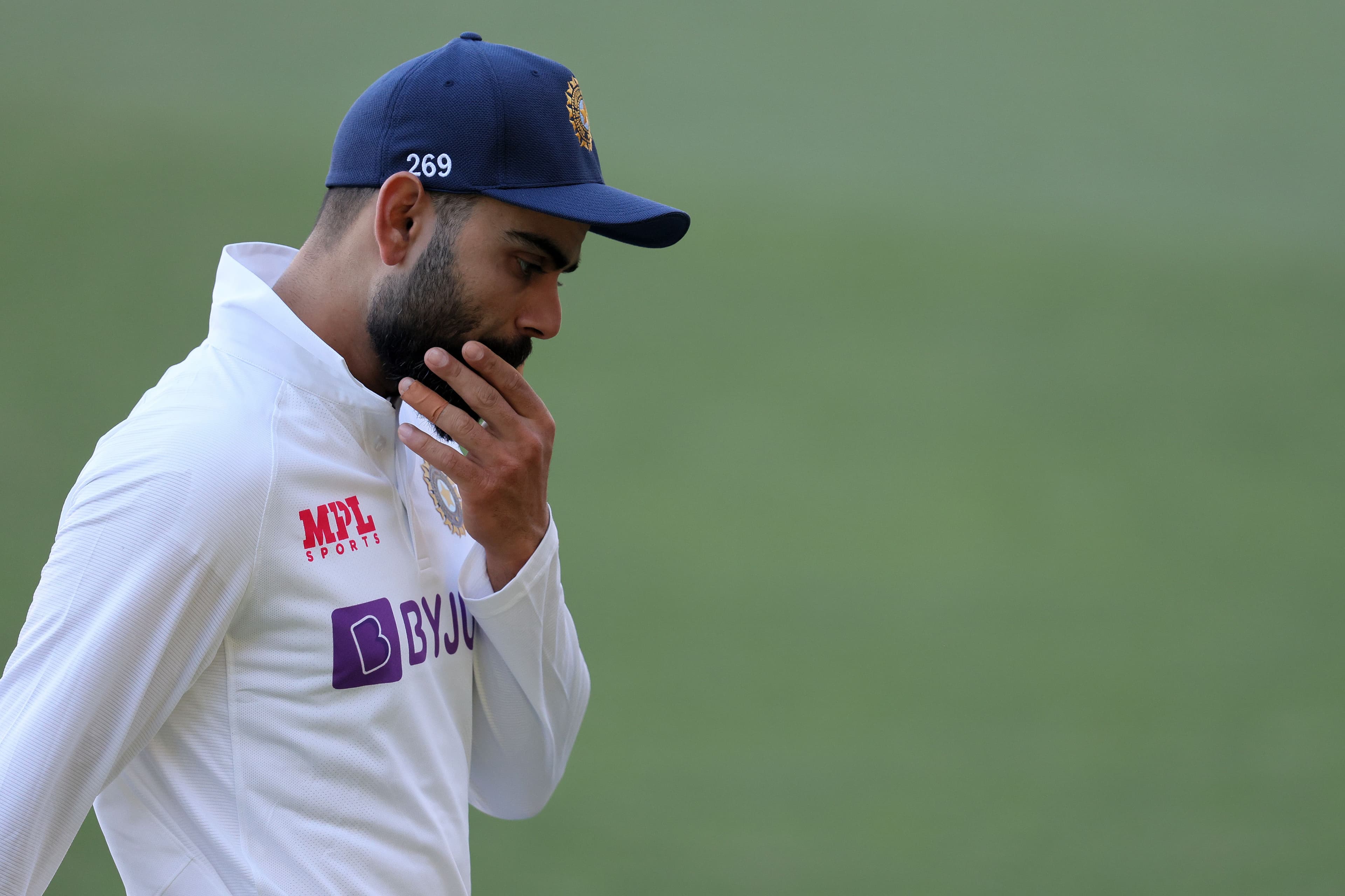 Virat Kohli of India walks off the field