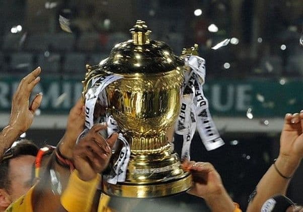 A cricket team celebrating after winning the IPL trophy