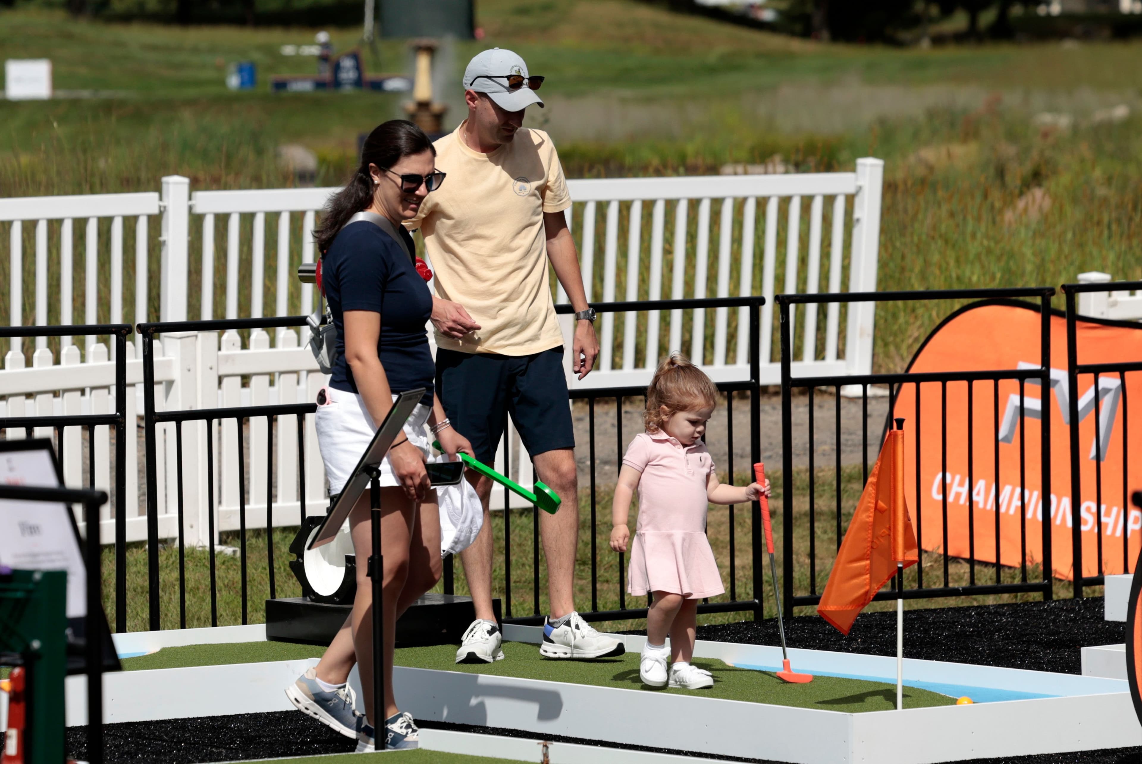 A future LPGA star plays mini golf during the first round of the FM Global Championship