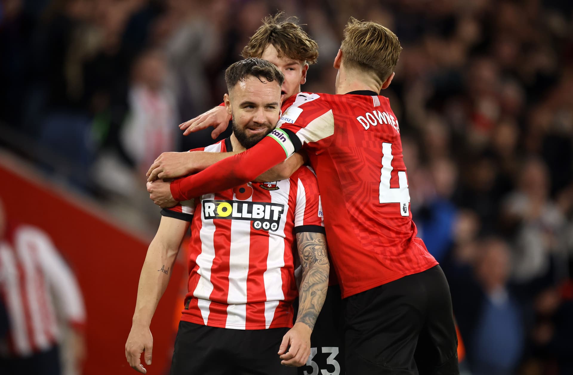 Adam Armstrong celebrating with teammate Tyler Dibling and Flynn Downes