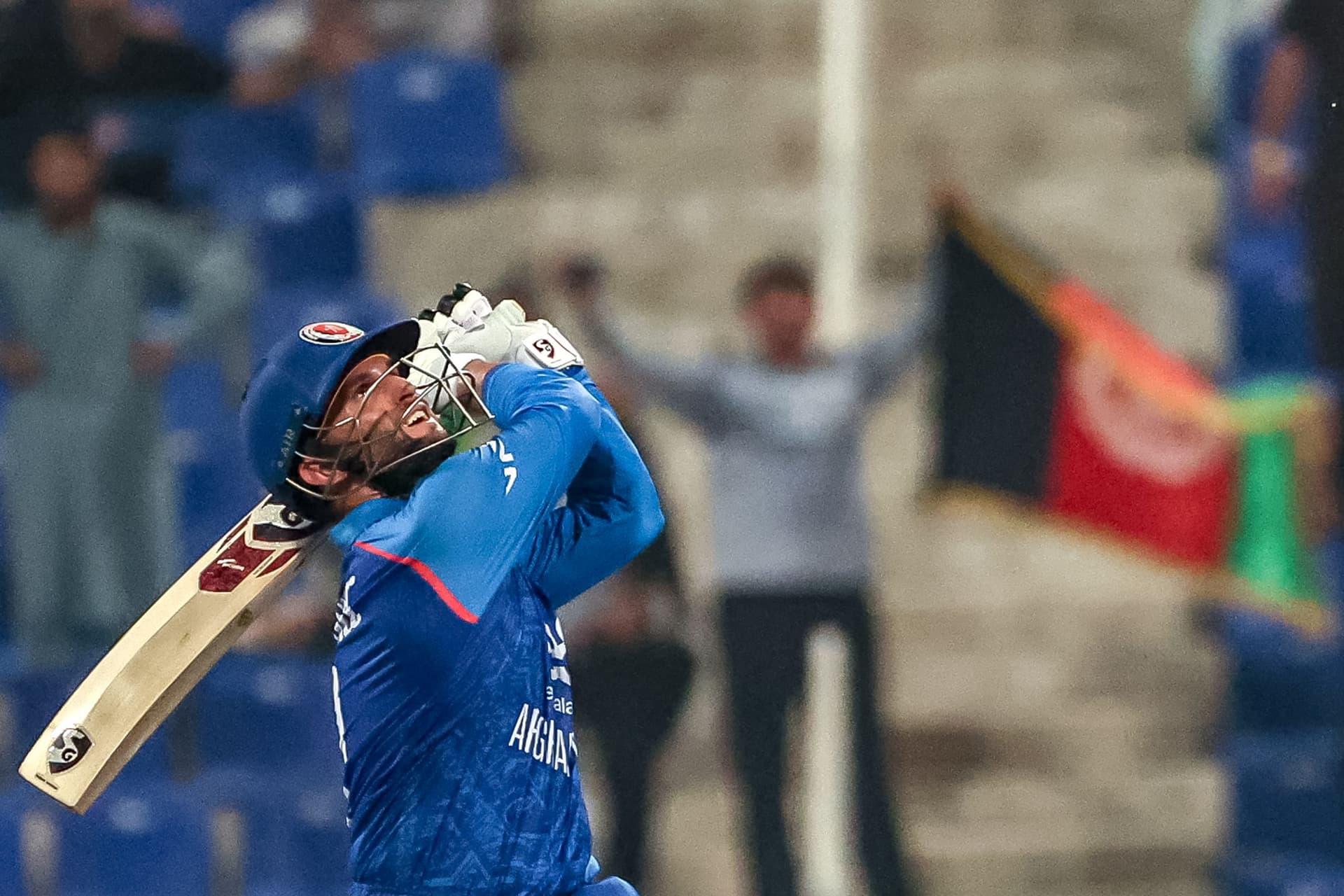 Afghanistan's Azmatullah Omarzai watches the ball after playing a shot.jpg