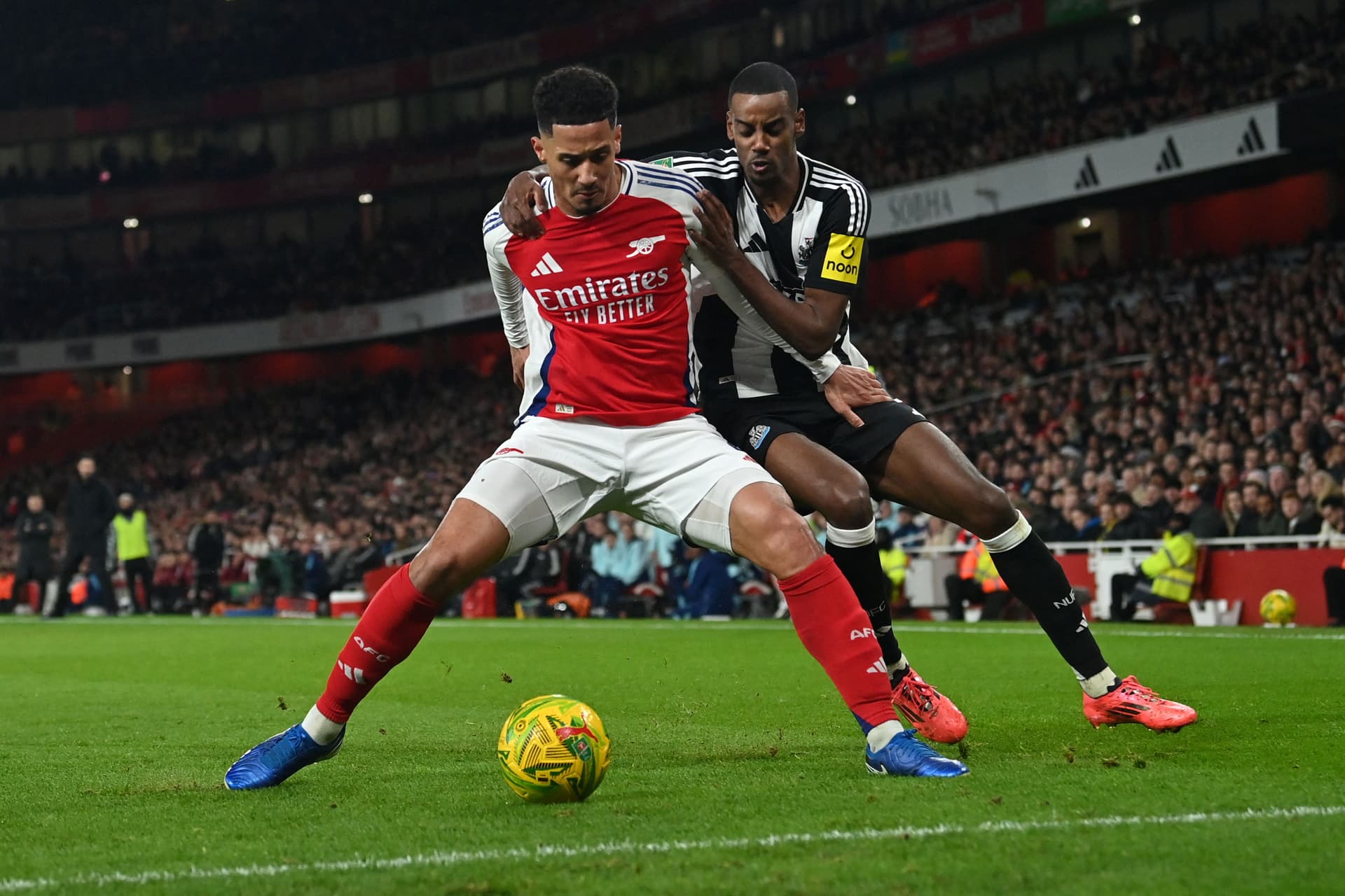 Alexander Isak vies with William Saliba