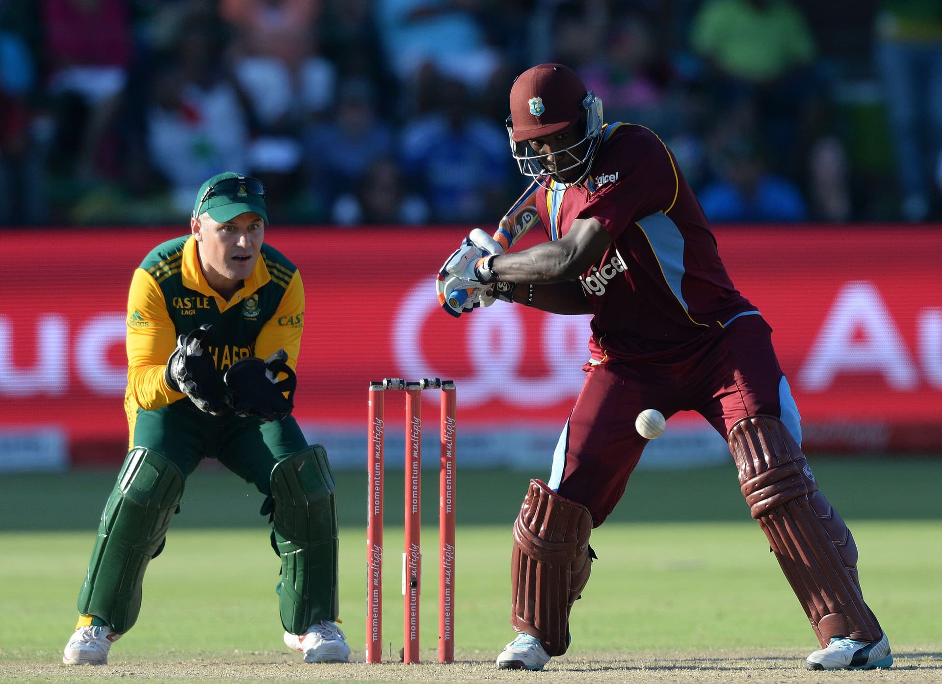 Andre Russell of West Indies unwinds to hit a six