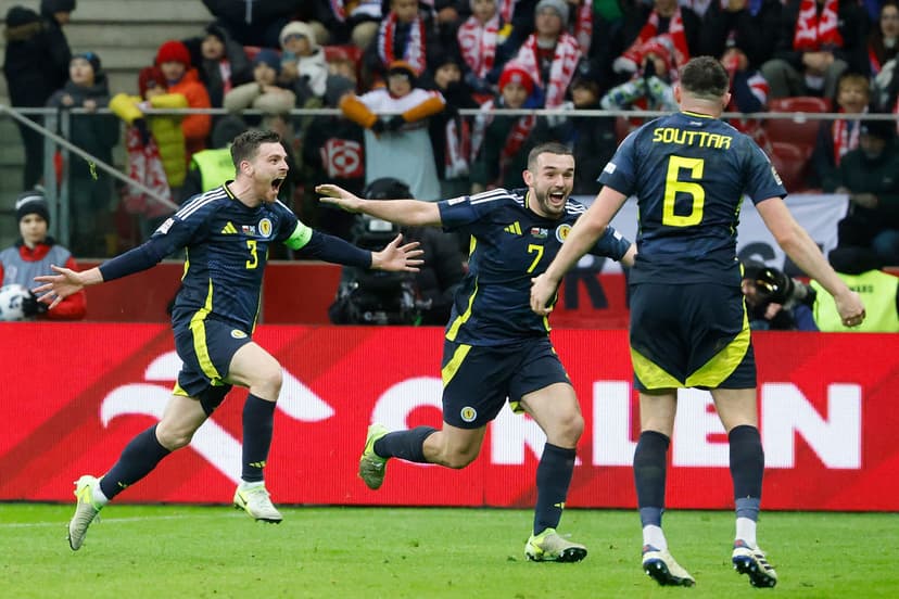 Andrew Robertson (L) celebrates scoring the 1-2 goal with his teammates Scotland's midfielder