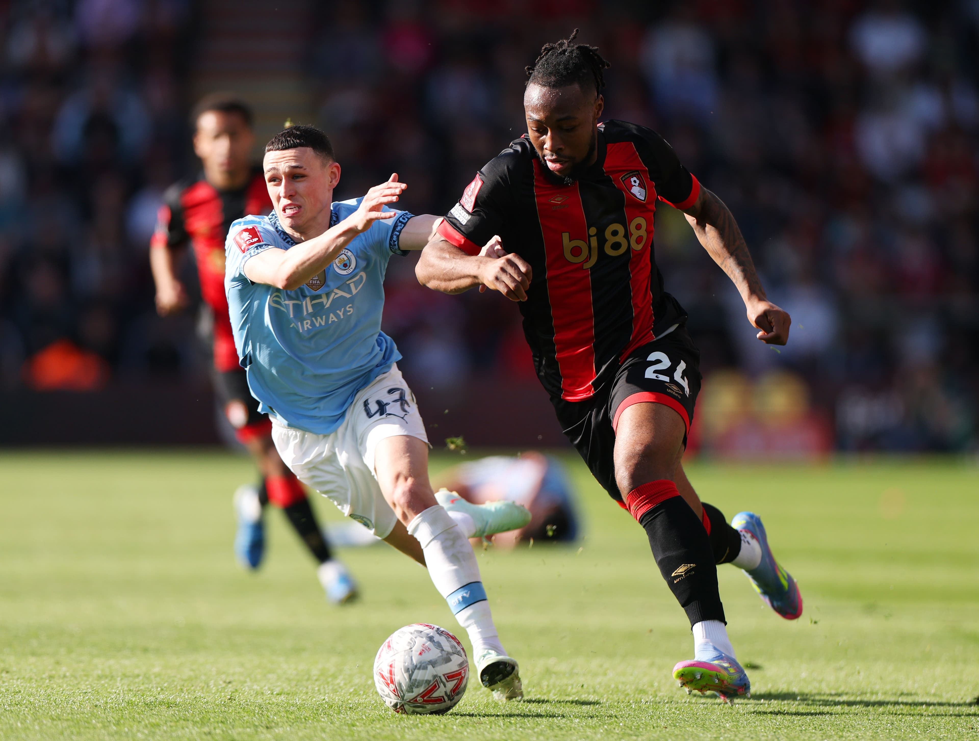 Antoine Semenyo of AFC Bournemouth is challenged by Phil Foden of Manchester City
