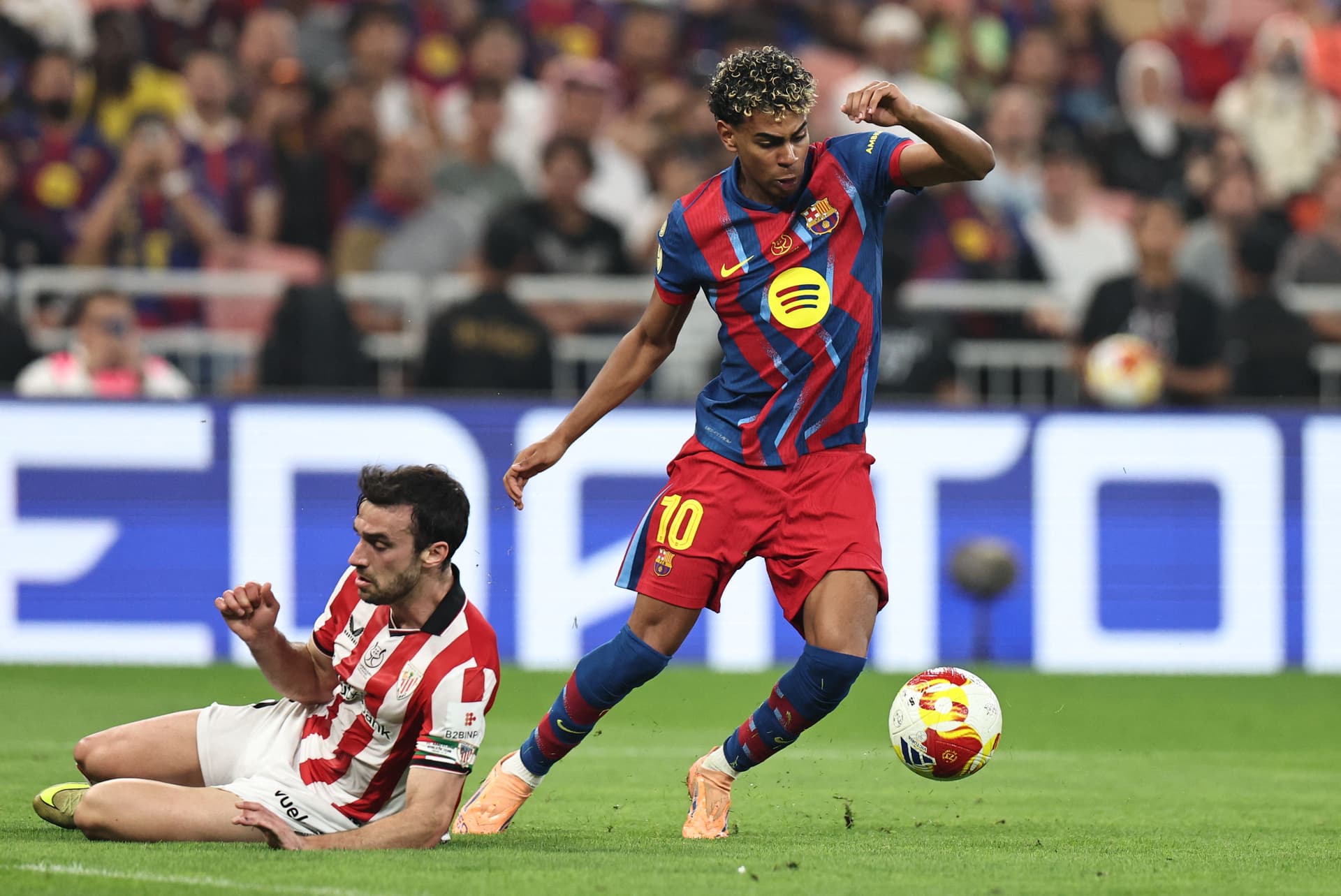 Inigo Lekue tackles Lamine Yamal