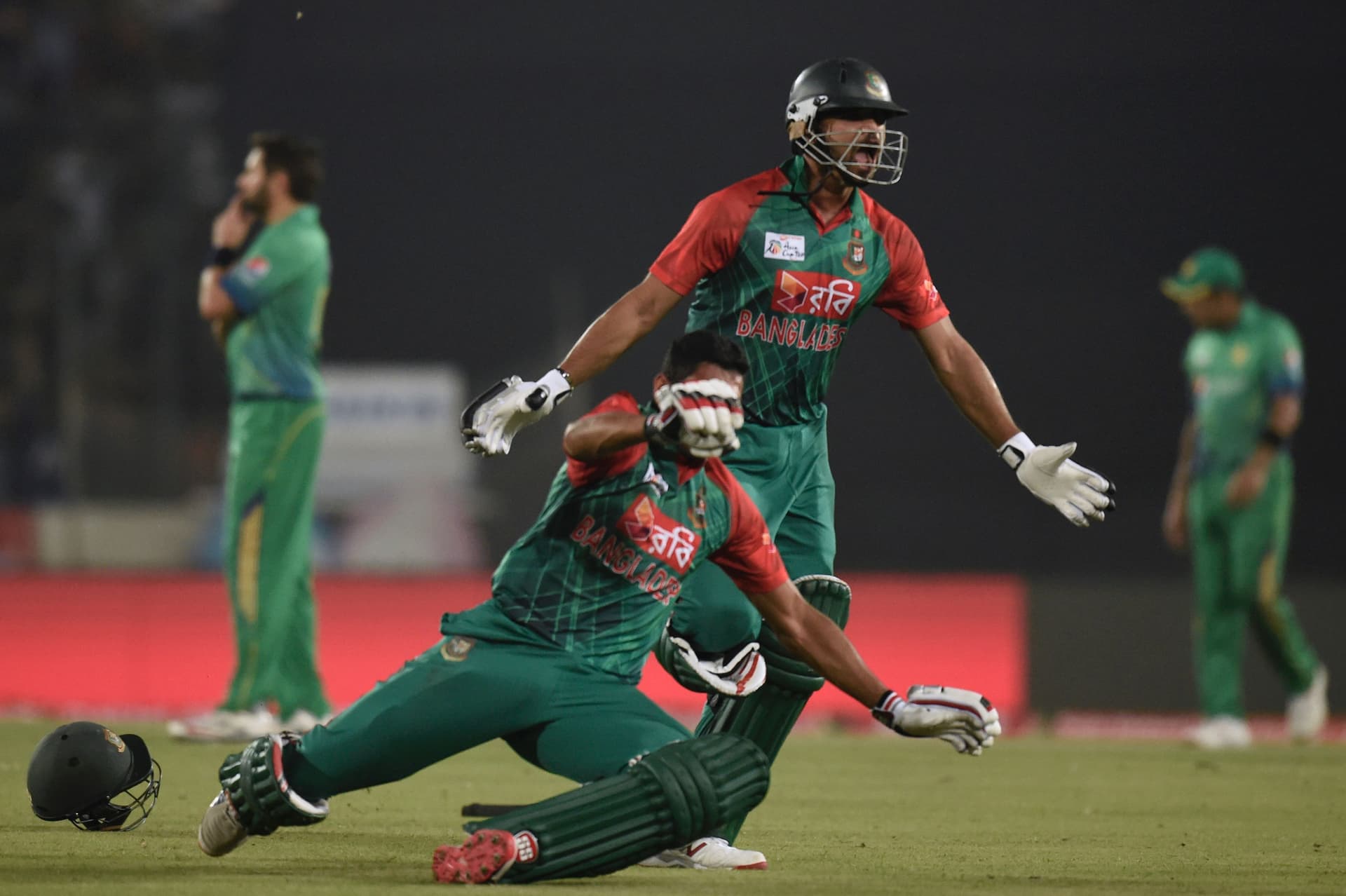 Bangladesh cricket captain Mashrafe Bin Mortaza (2nd R) celebrates after winning.jpg
