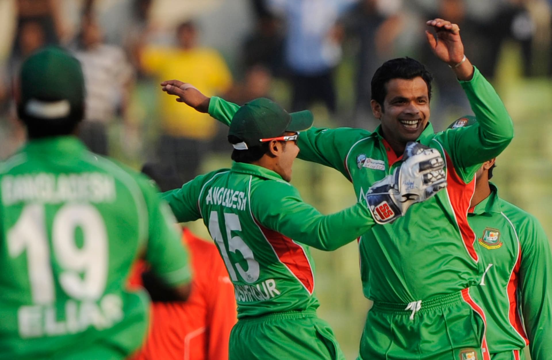 Bangladeshi cricketer Abdur Razzak (R) celebrates with his captain Mushfiqur Rahim.jpg