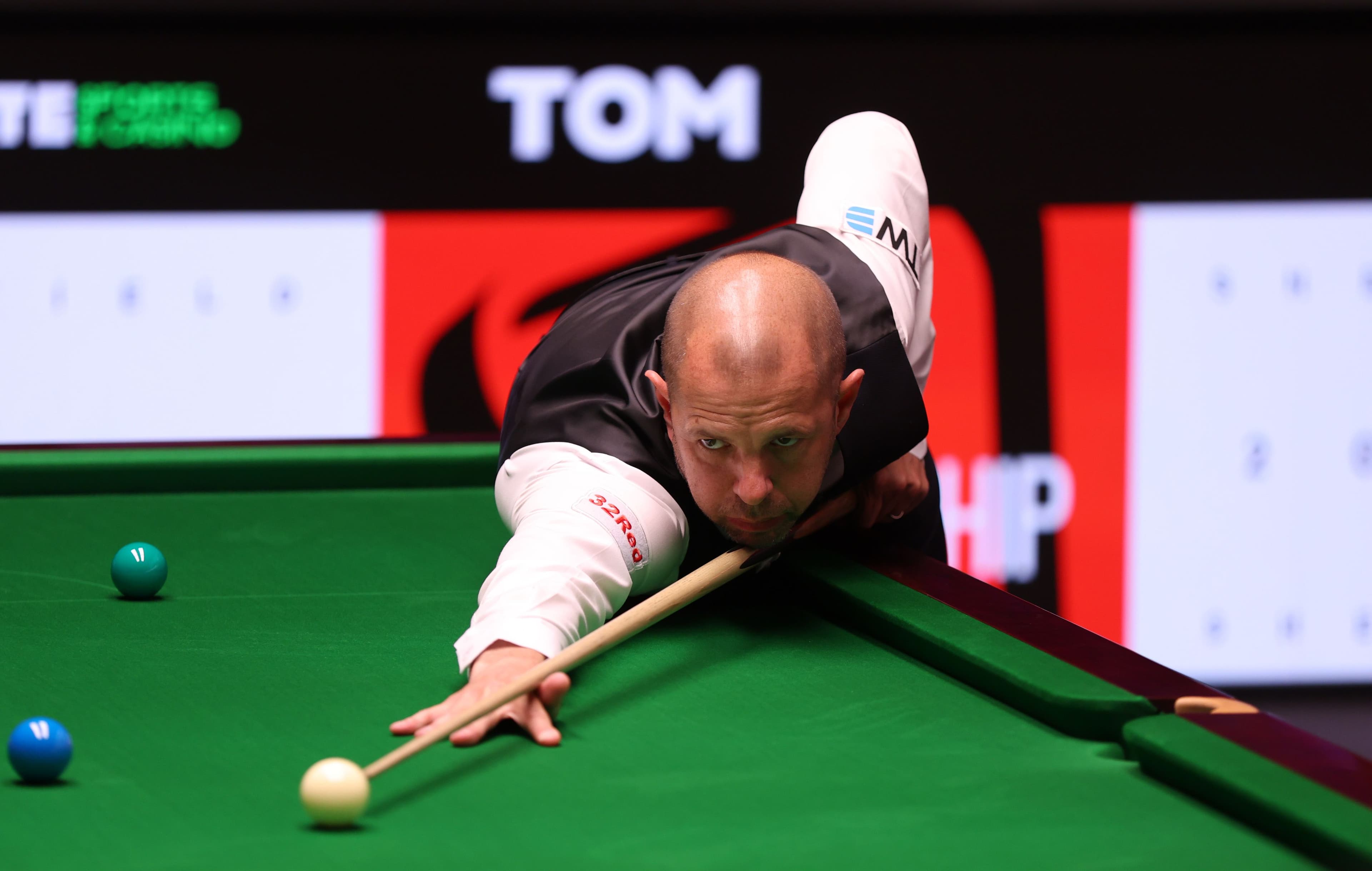 Barry Hawkins of England plays a shot against Hossein Vafaei