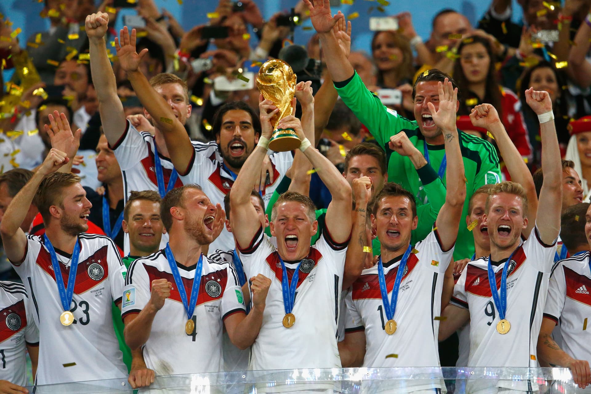 Bastian Schweinsteiger of Germany lifts the World Cup trophy