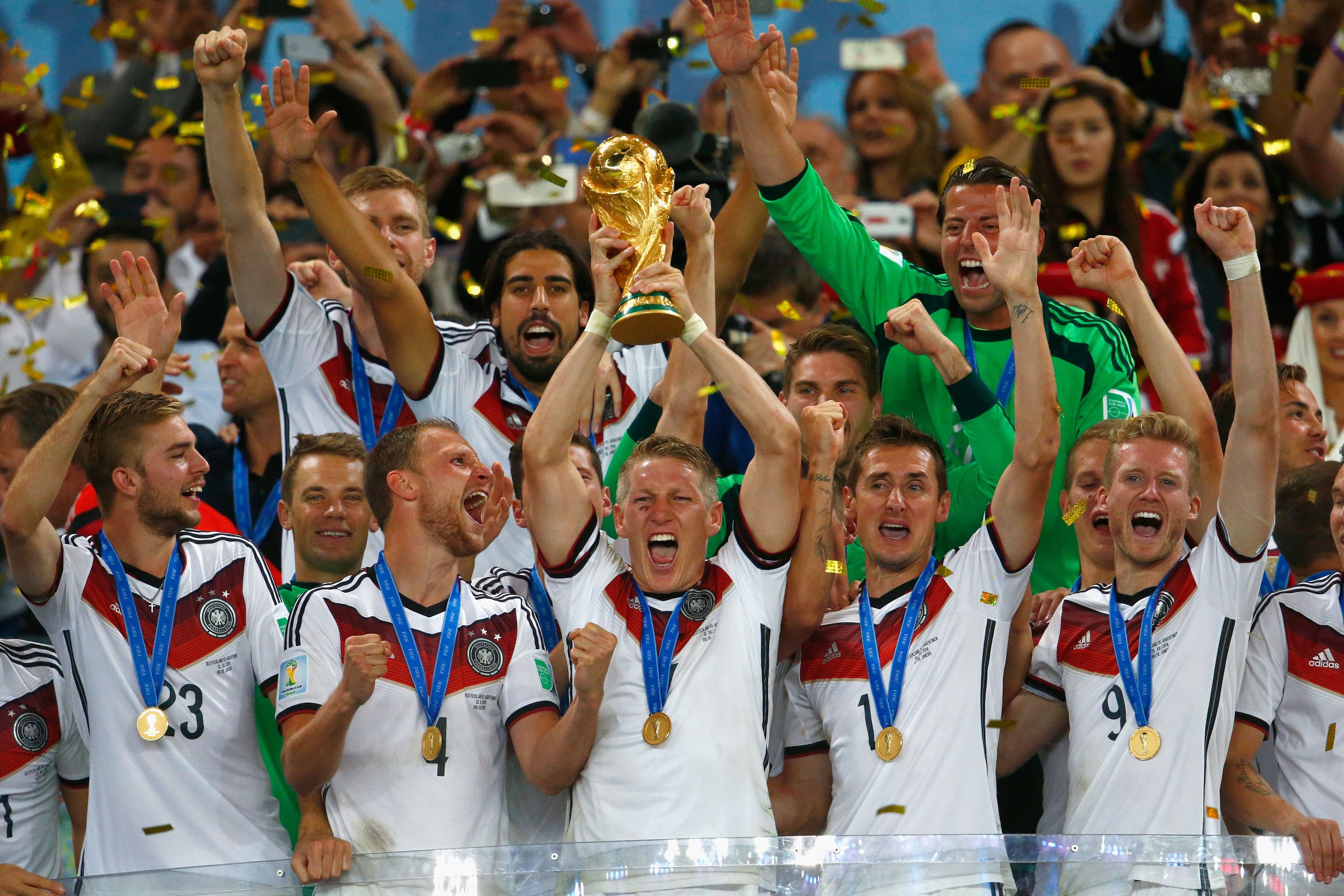 Bastian Schweinsteiger of Germany lifts the World Cup trophy