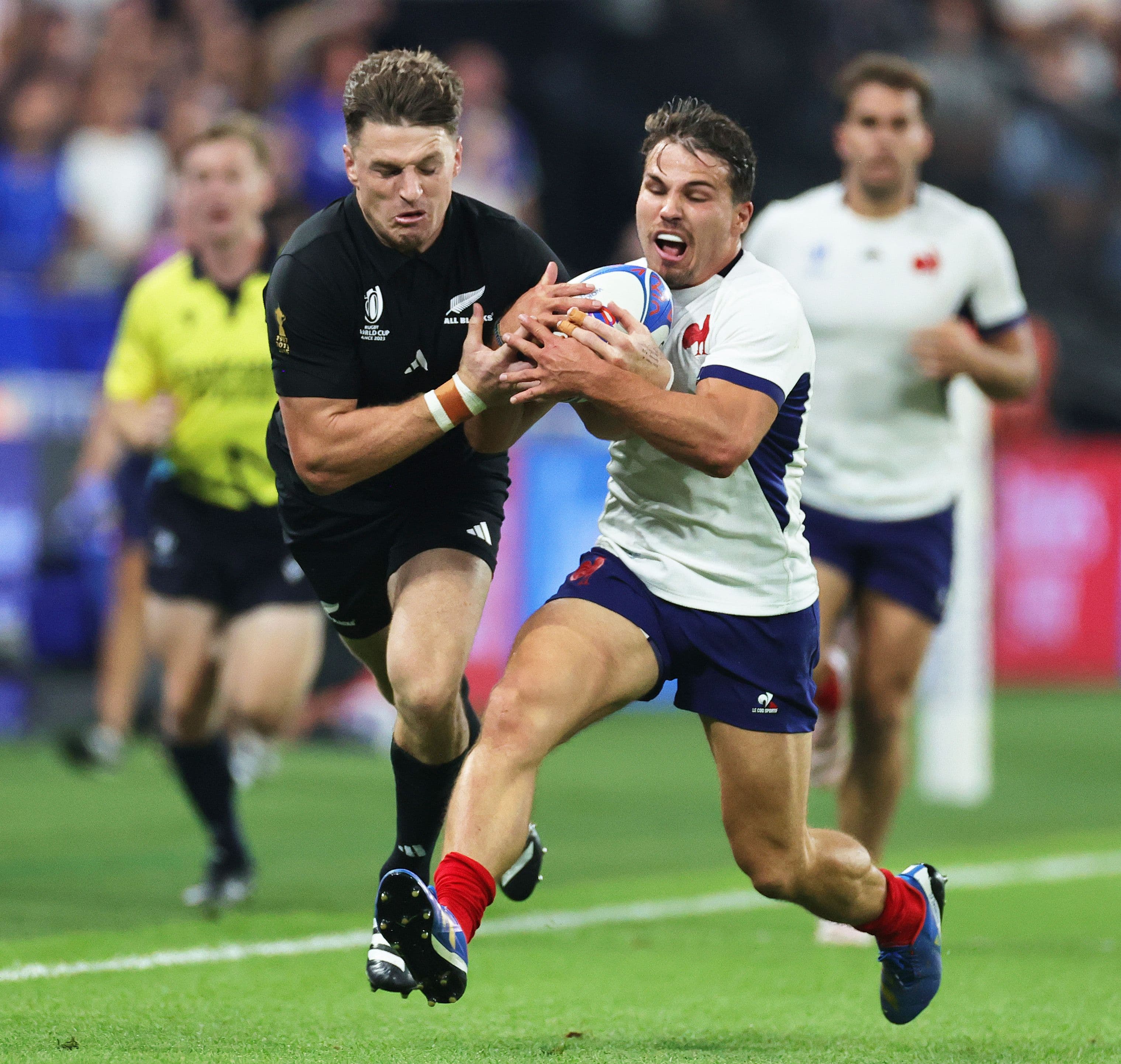 Beauden Barrett of New Zealand and Antoine Dupont of France compete for the ball during the Rugby World Cup France 2023.jpg