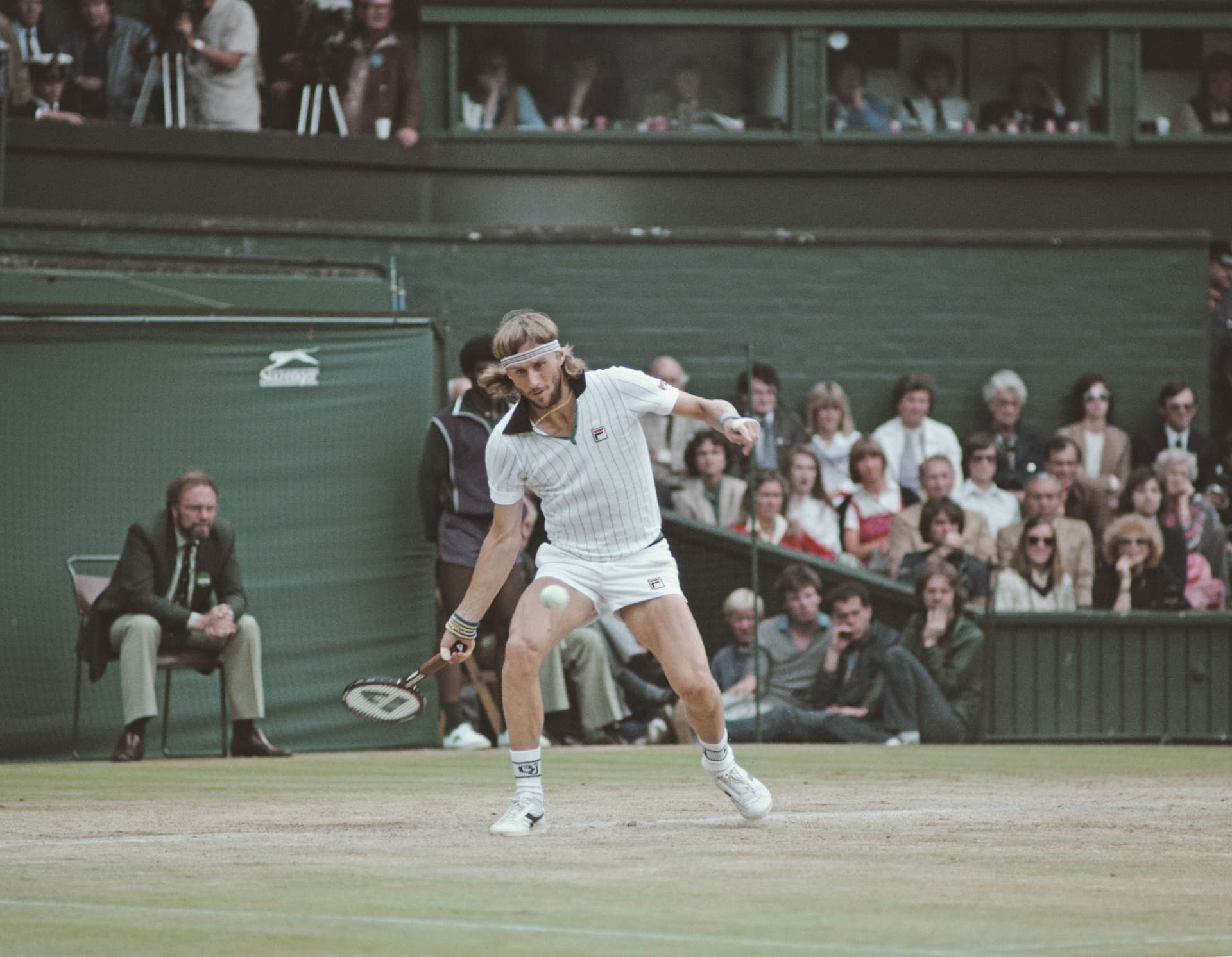 Bjorn Borg of Sweden plays a forehand return to John McEnroe