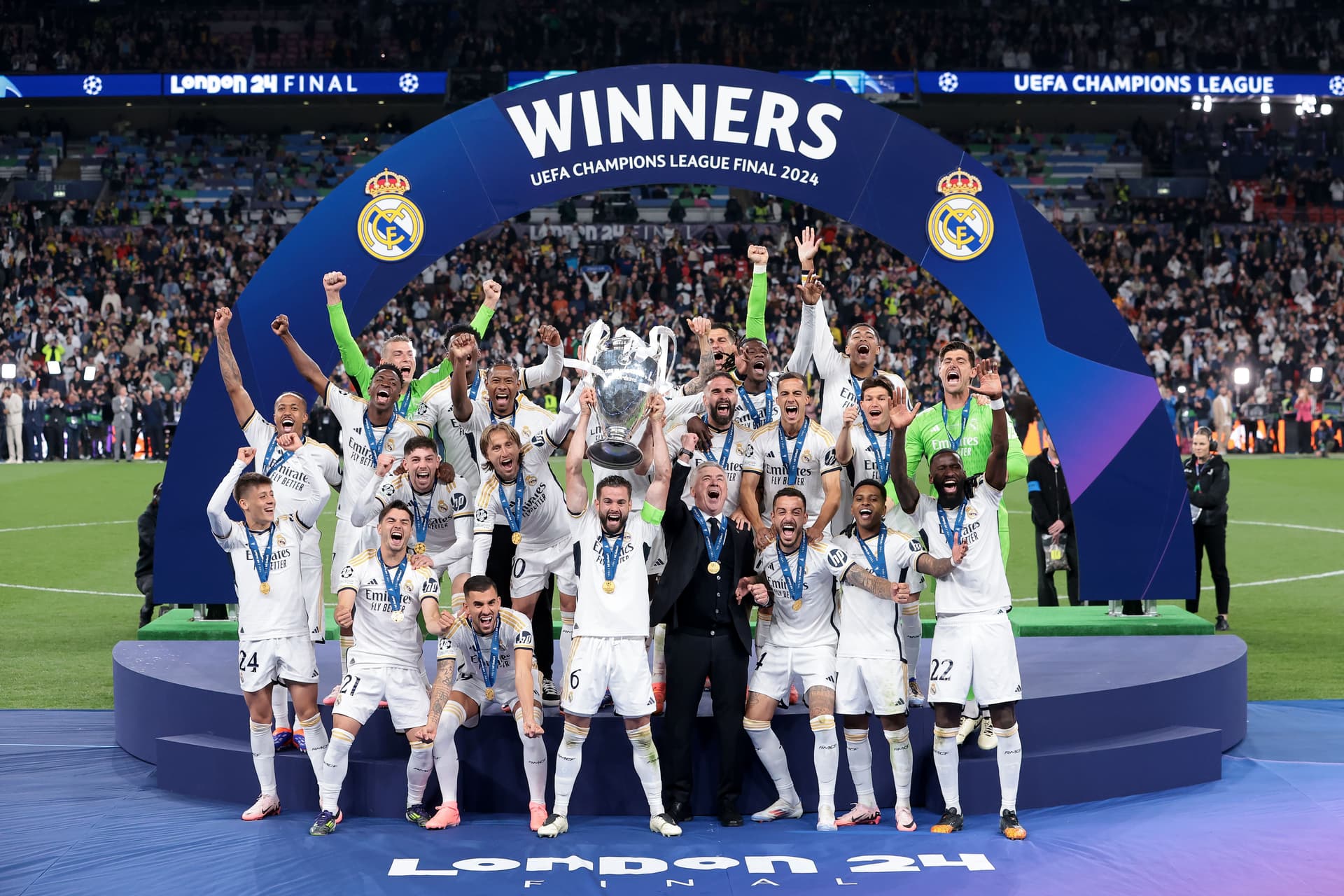 Real Madrid players and Carlo Ancelotti Head coach of Real Madrid celebrate with the trophy the UEFA Champions League 2023/24