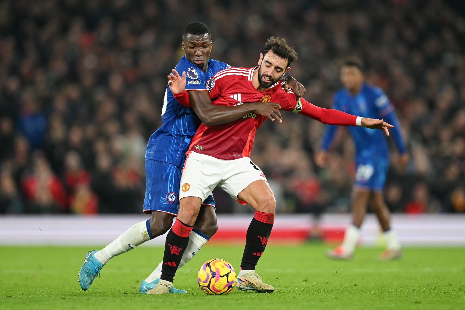 Bruno Fernandes of Manchester United is challenged by Moises Caicedo of Chelsea