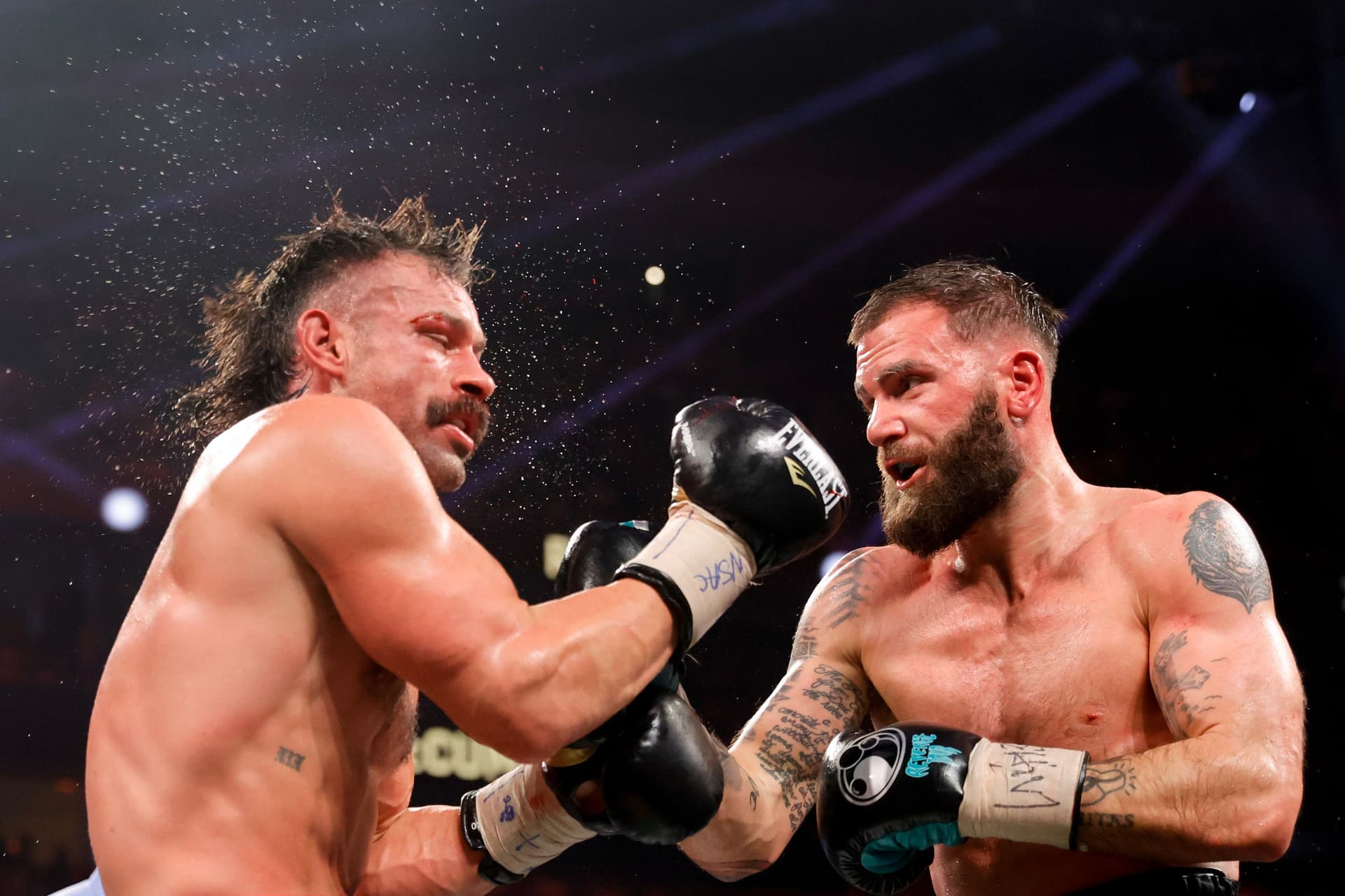 Caleb Plant punches Trevor McCumby during the eighth round of a super middleweight.jpg