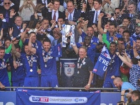 Cardiff City (Wales) Manager Neil Warnock and players lift the 2017–18 EFL Championship runner-up trophy after winning promotion to the Premier League