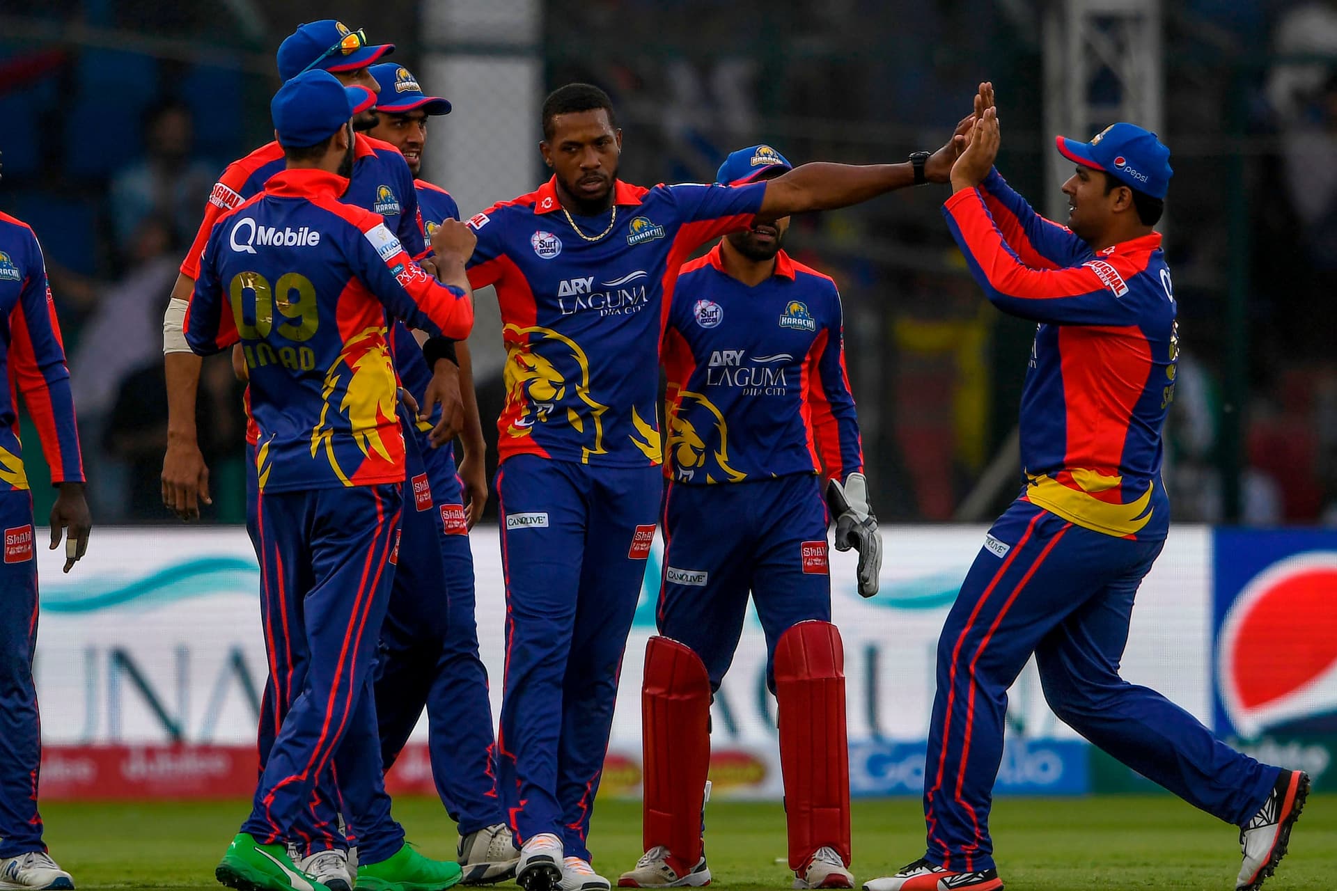 Chris Jordan (3R) celebrates with teammates after taking the wicket of Peshawar Zalmi.jpg