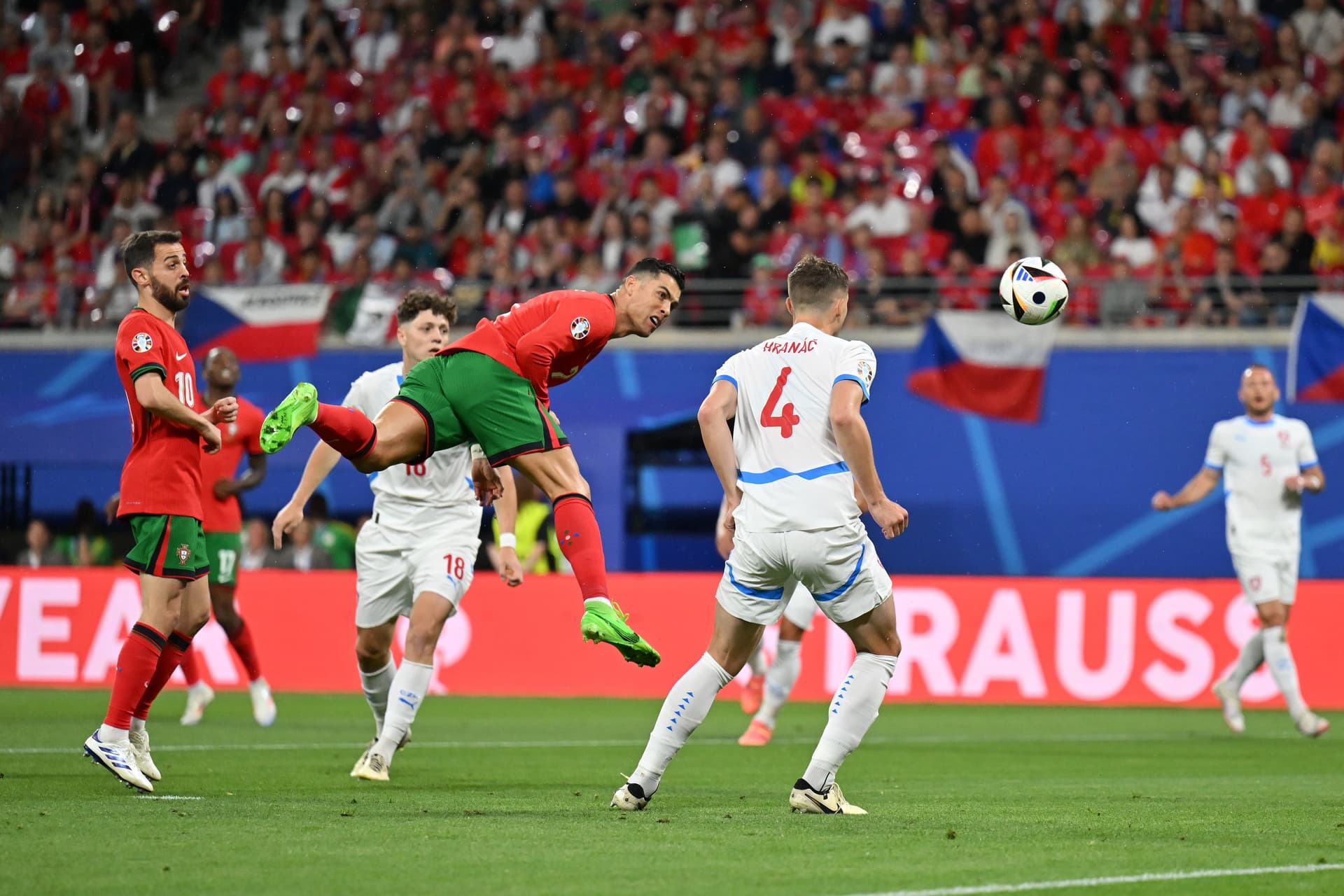 Cristiano Ronaldo of Portugal competes for a header whilst under pressure from Robin Hranac of Czechia