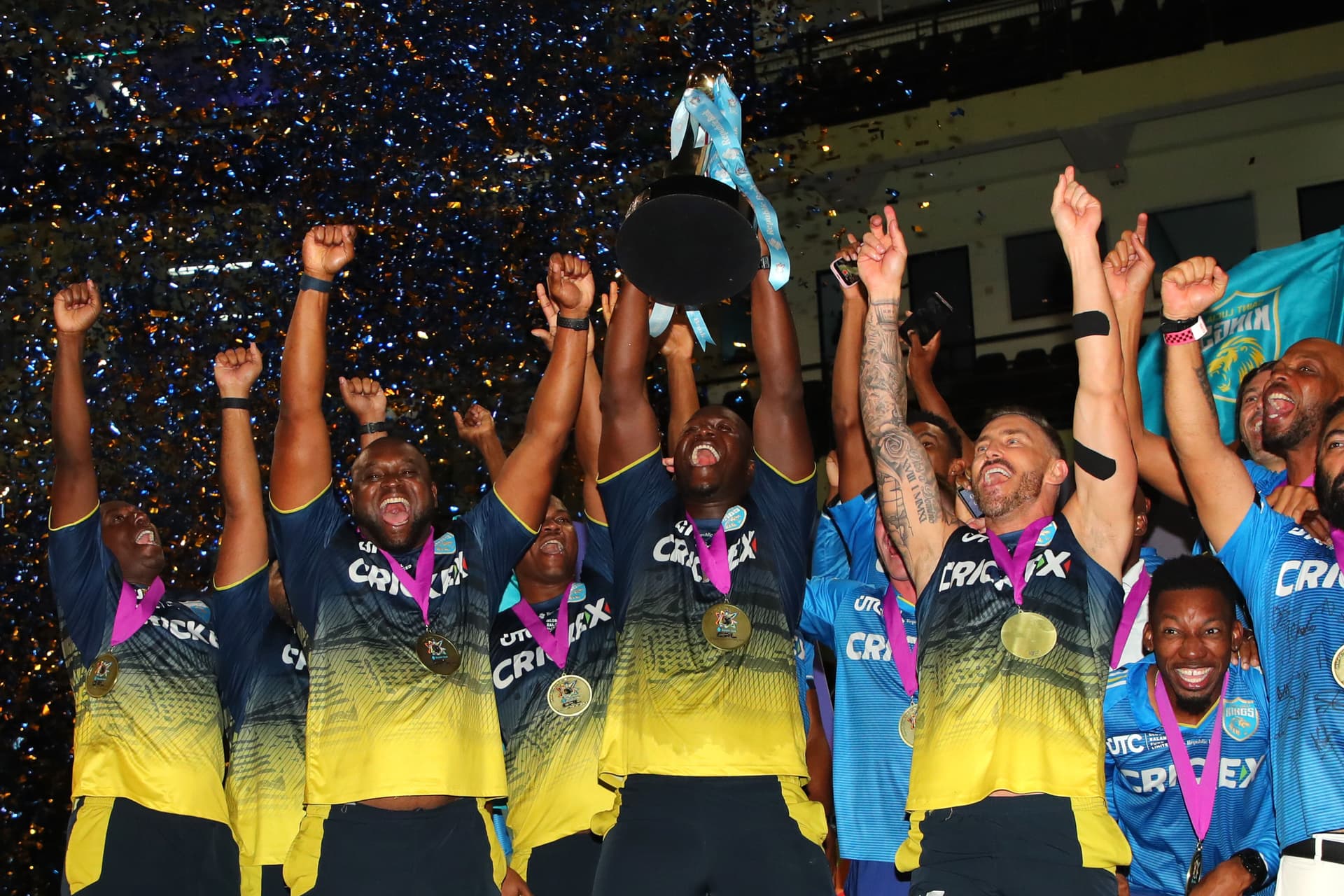 Daren Sammy, head coach of St.Lucia Kings lifts the CPL T20 trophy