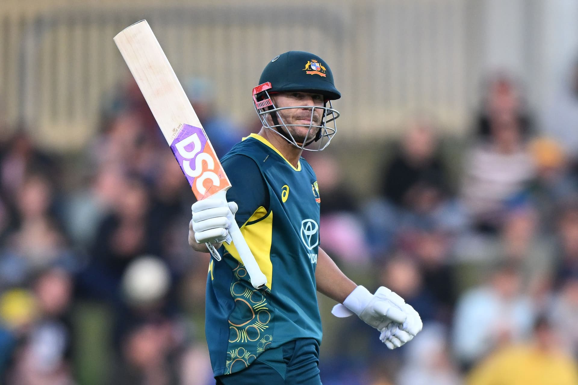 David Warner of Australia celebrates scoring a half century.jpg